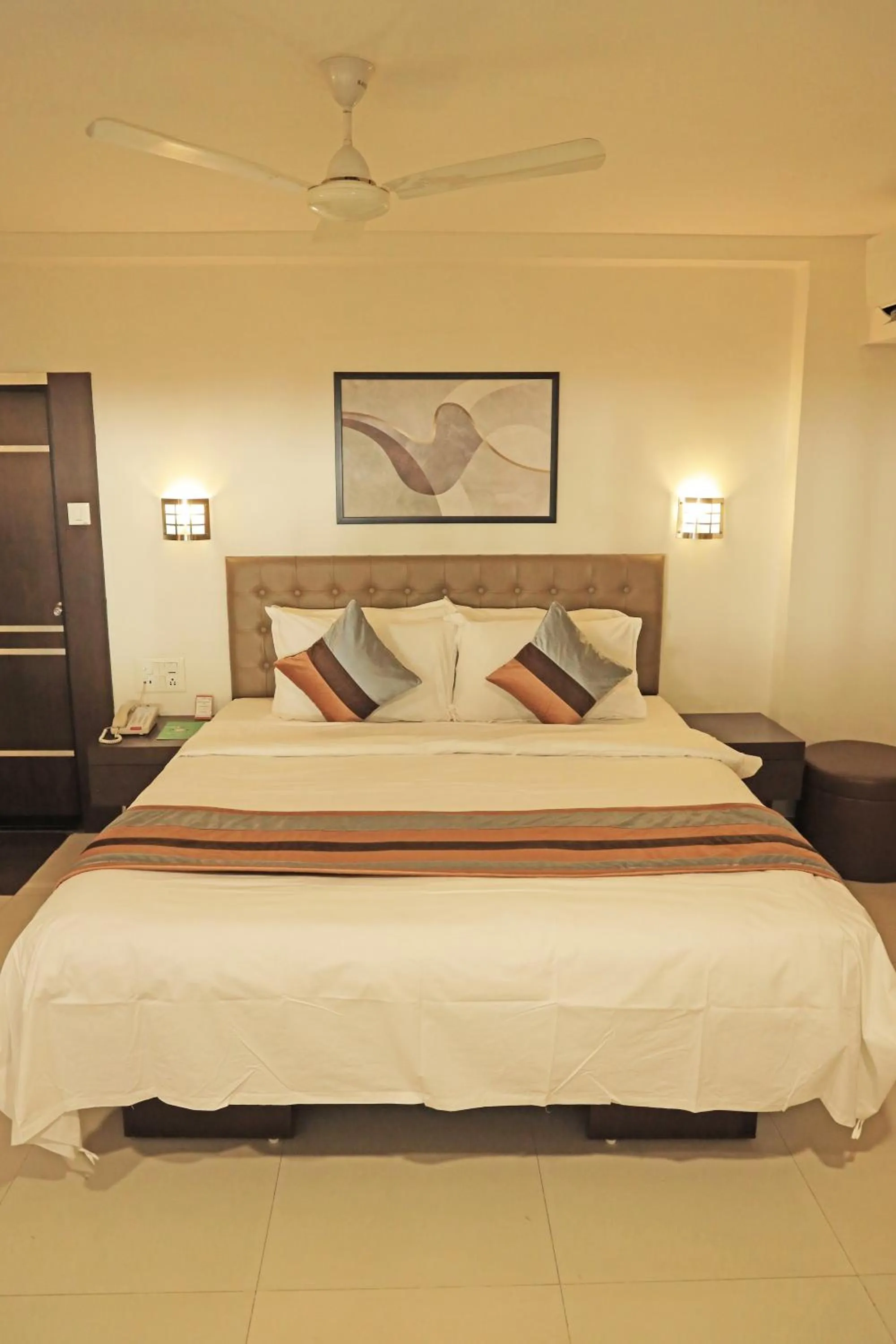 Bed in Click Hotel Yuvraj