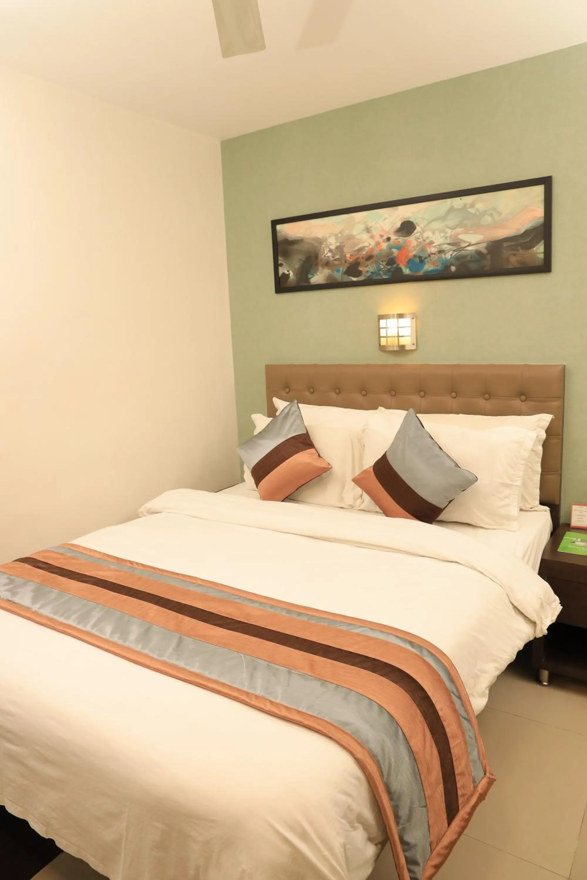 Bed in Click Hotel Yuvraj