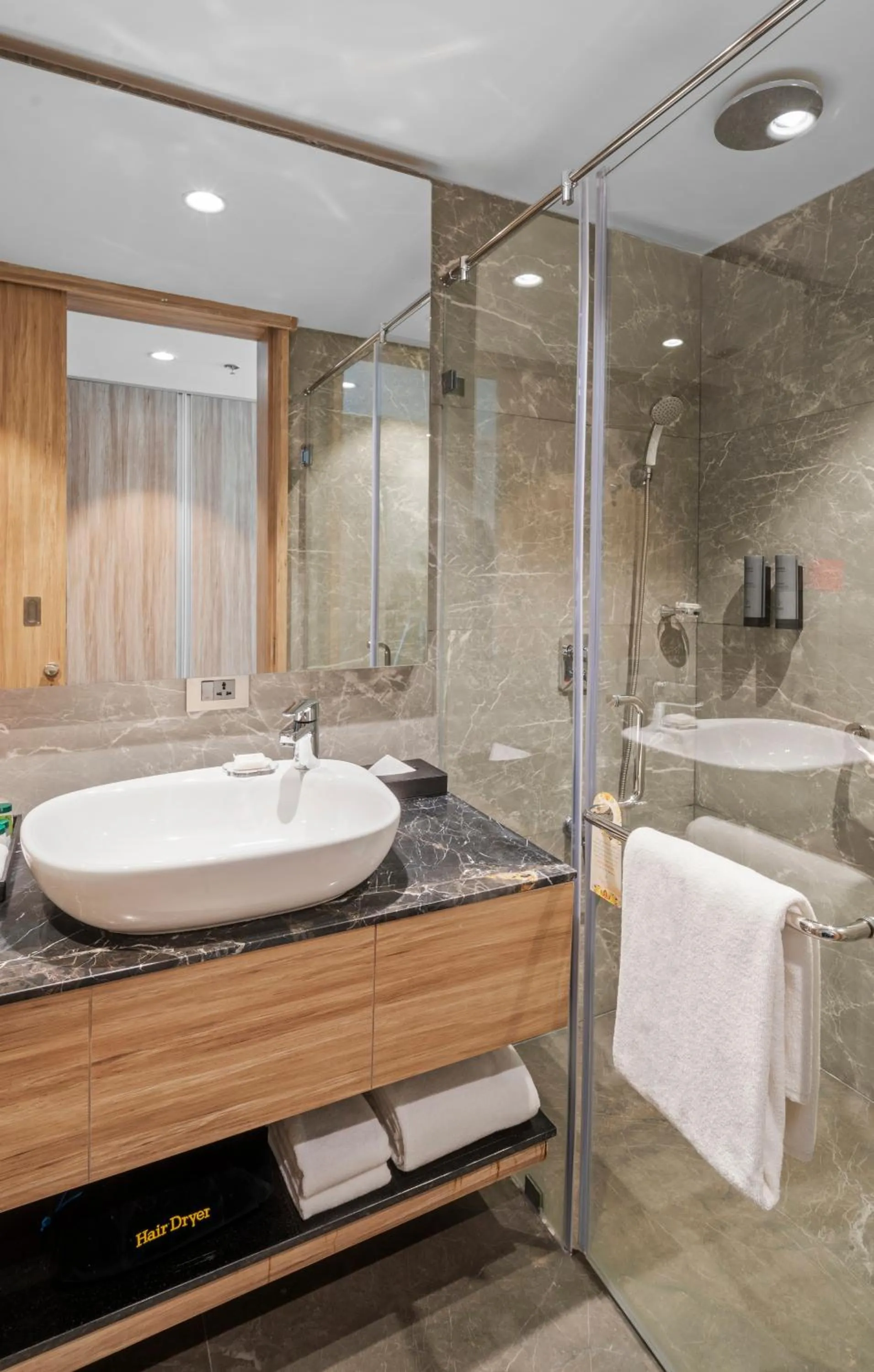 Bathroom in Grand Vijayawada by GRT Hotels