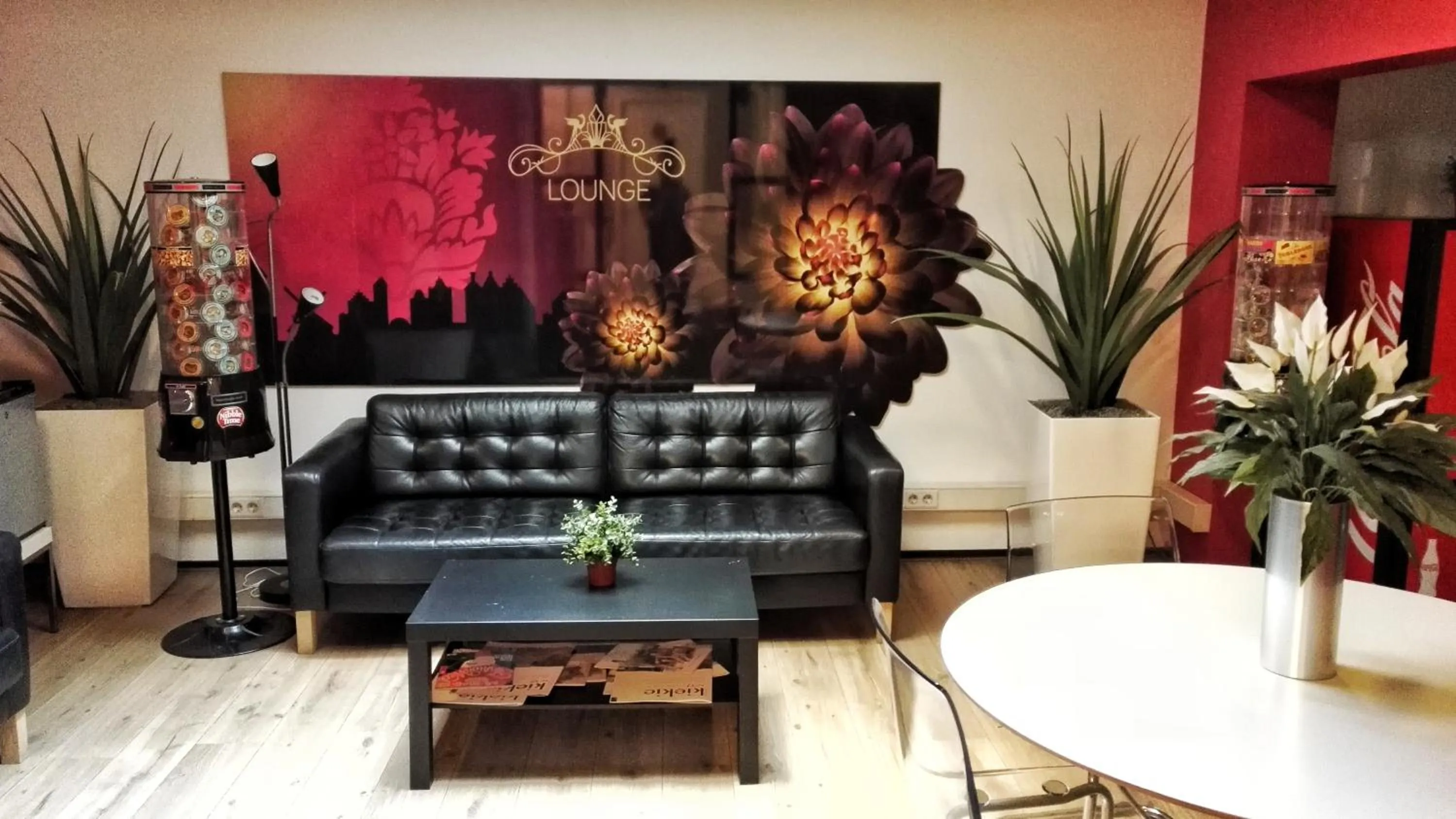 Communal lounge/ TV room in Rembrandt Square Hotel