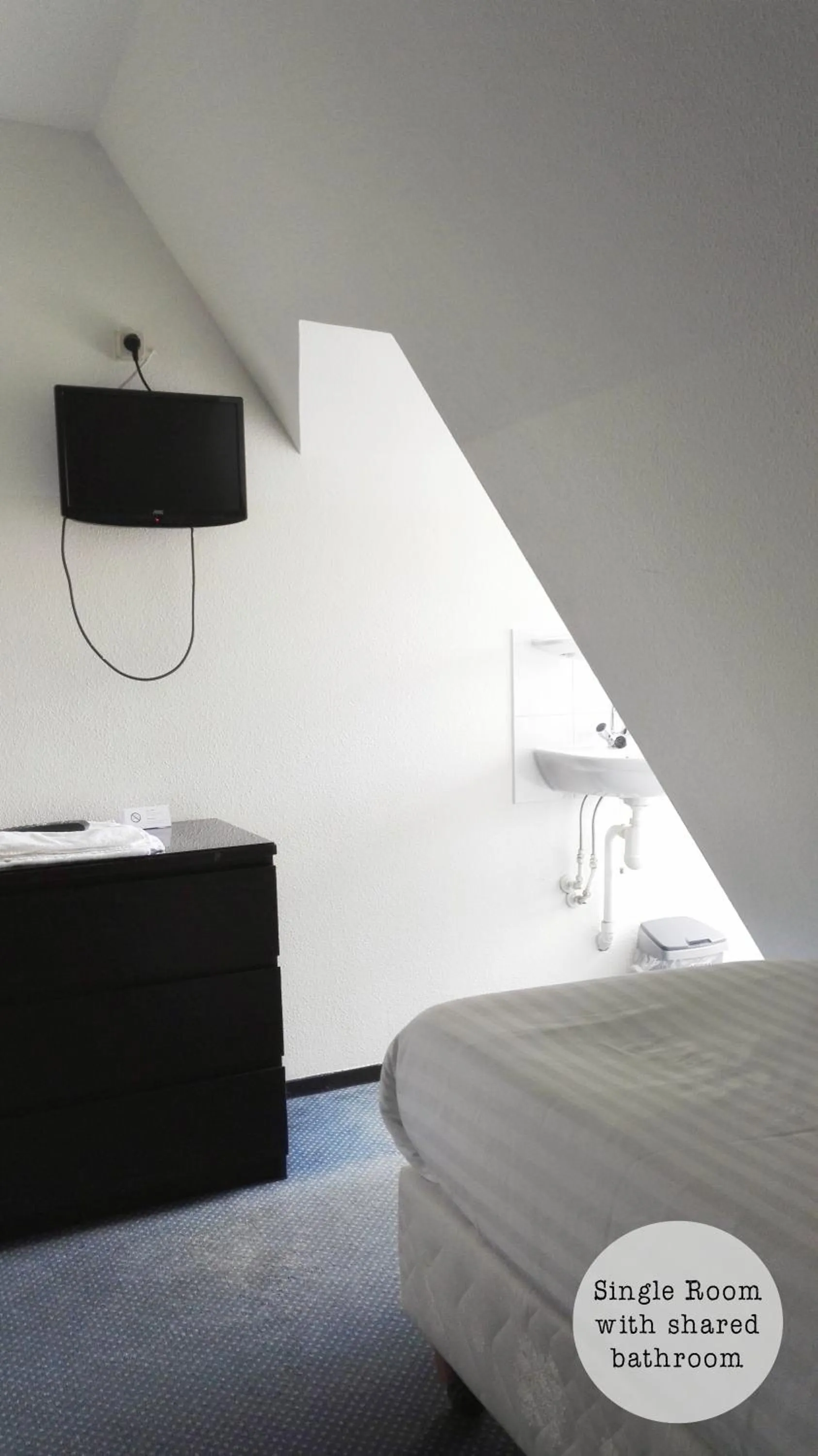 Bed in Rembrandt Square Hotel