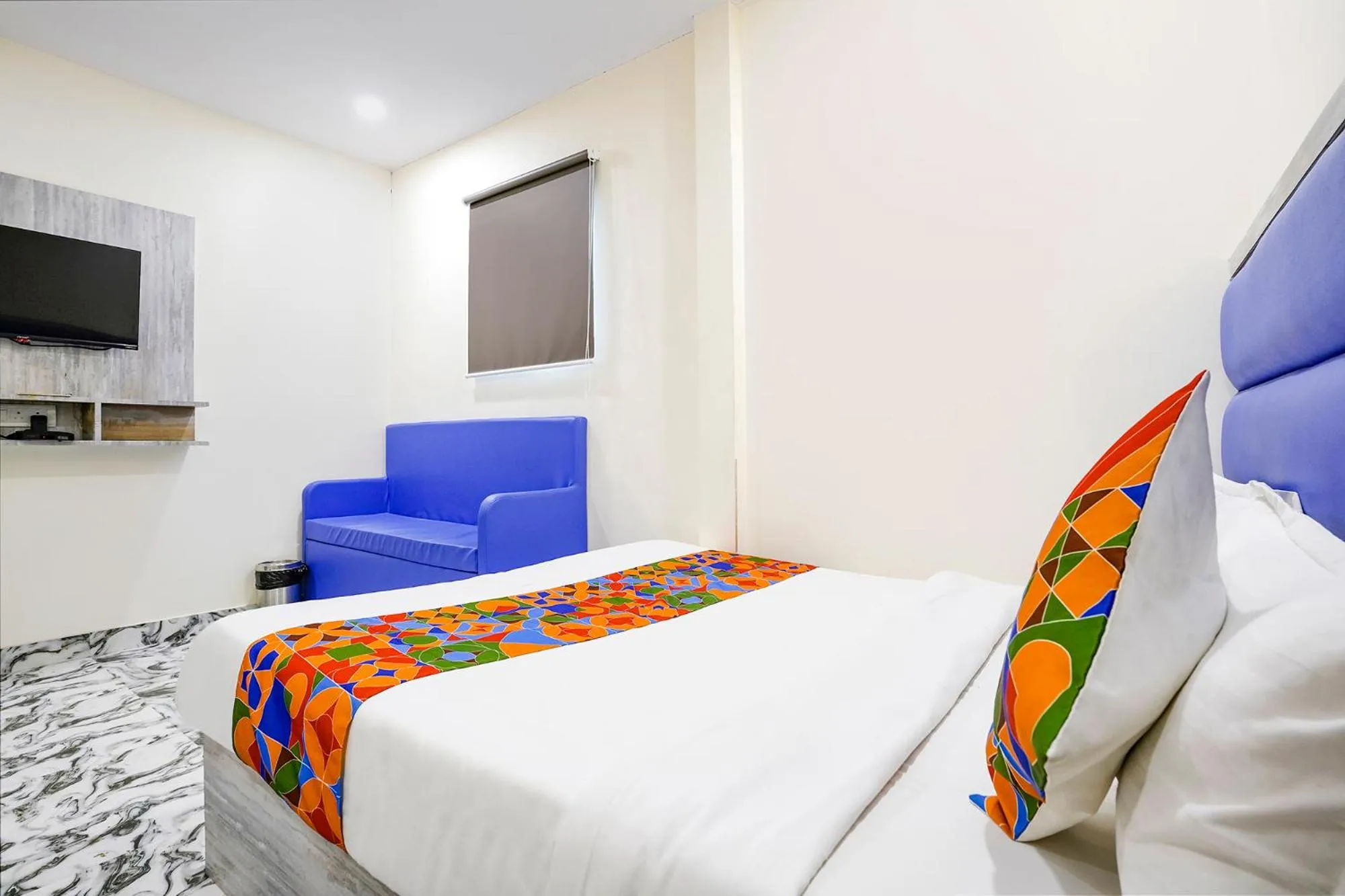 Bed in FabHotel Good Luck Residency