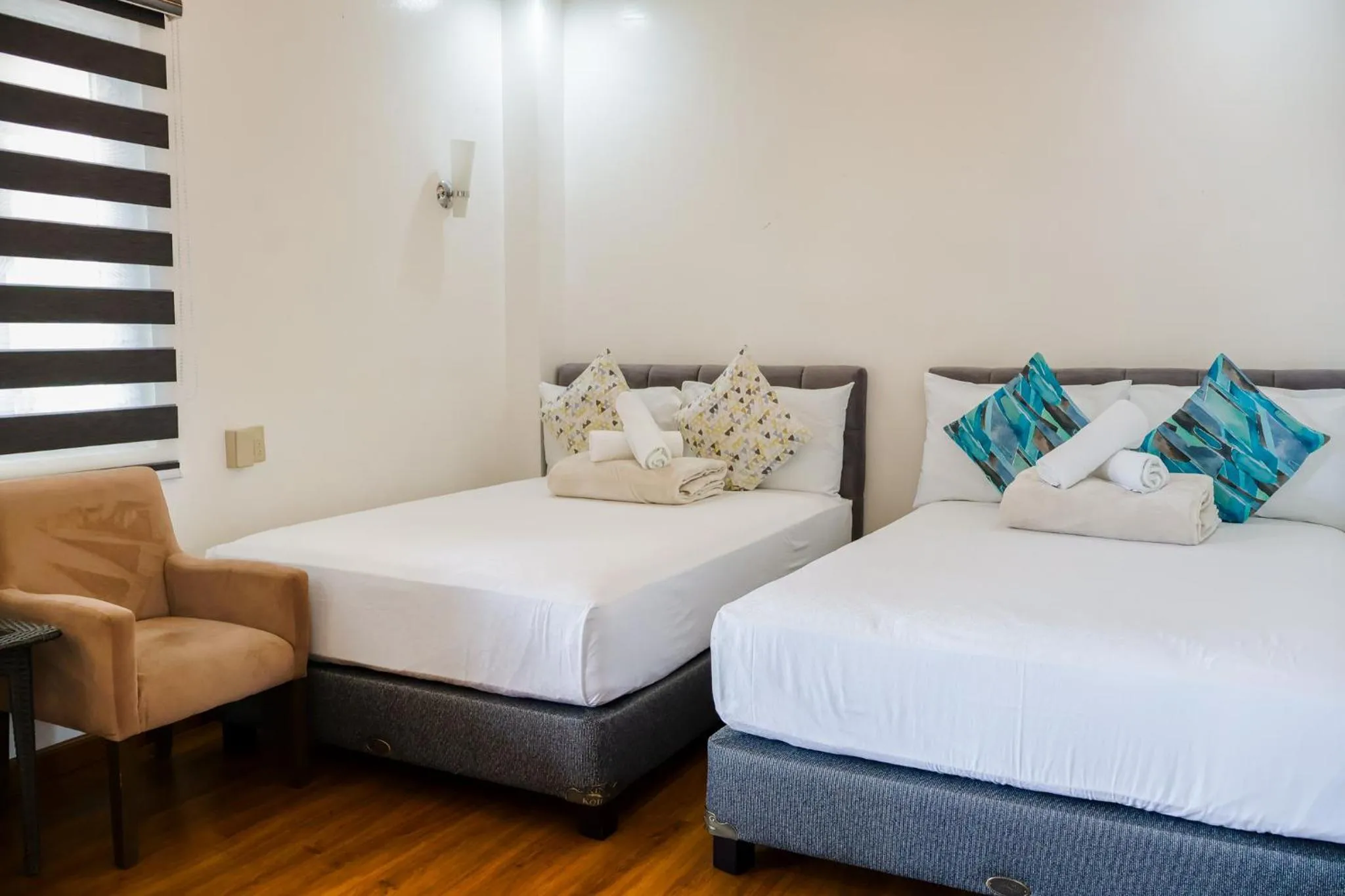 Bed in Teofely Gardens Resort near Tagaytay