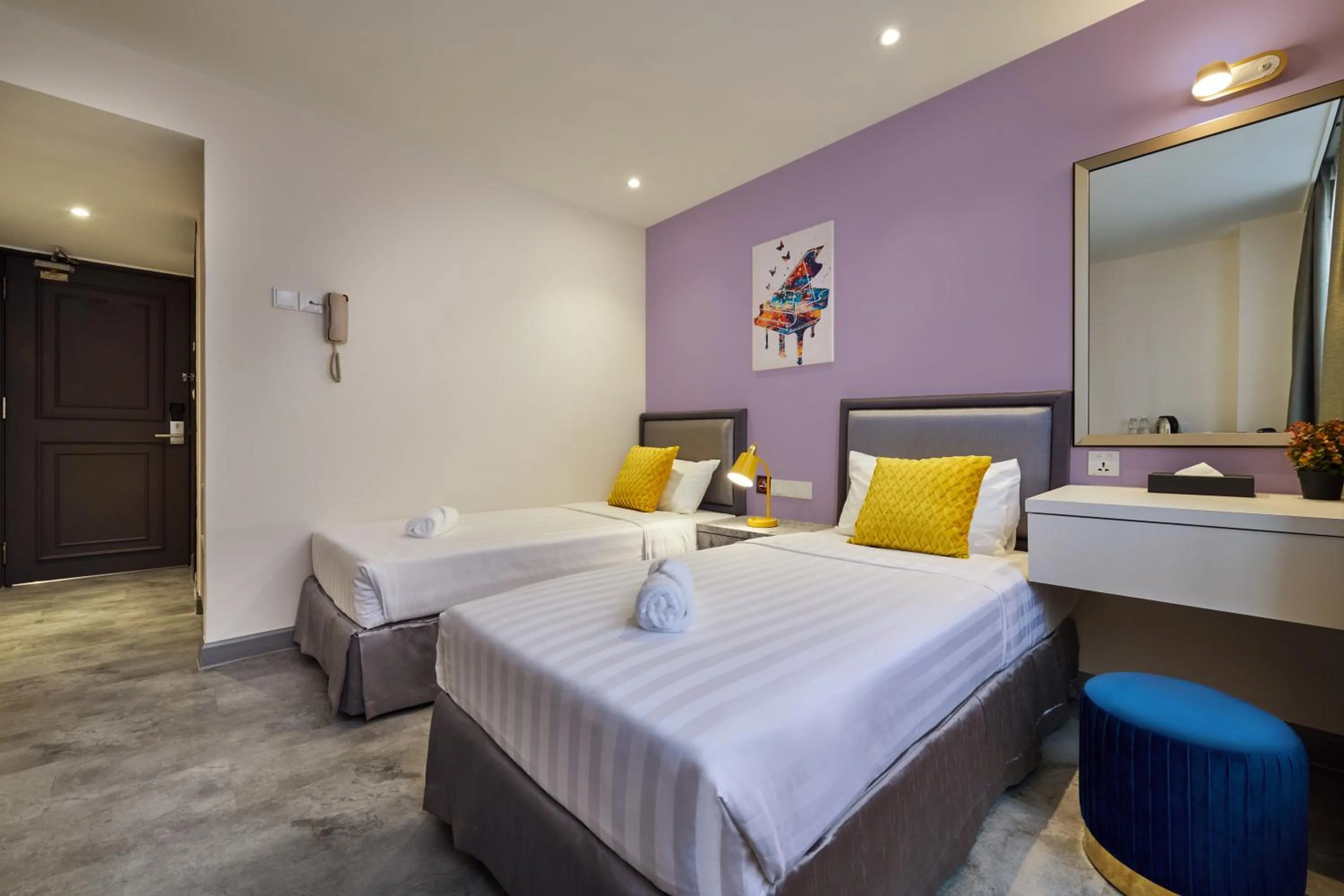 Bed in PJ De Inn Hotel