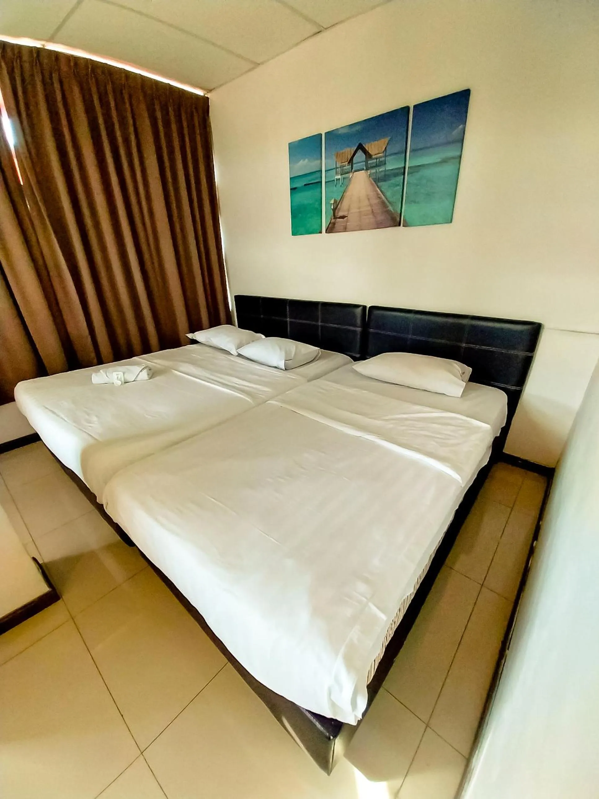 Bed in MB Budget Hotel