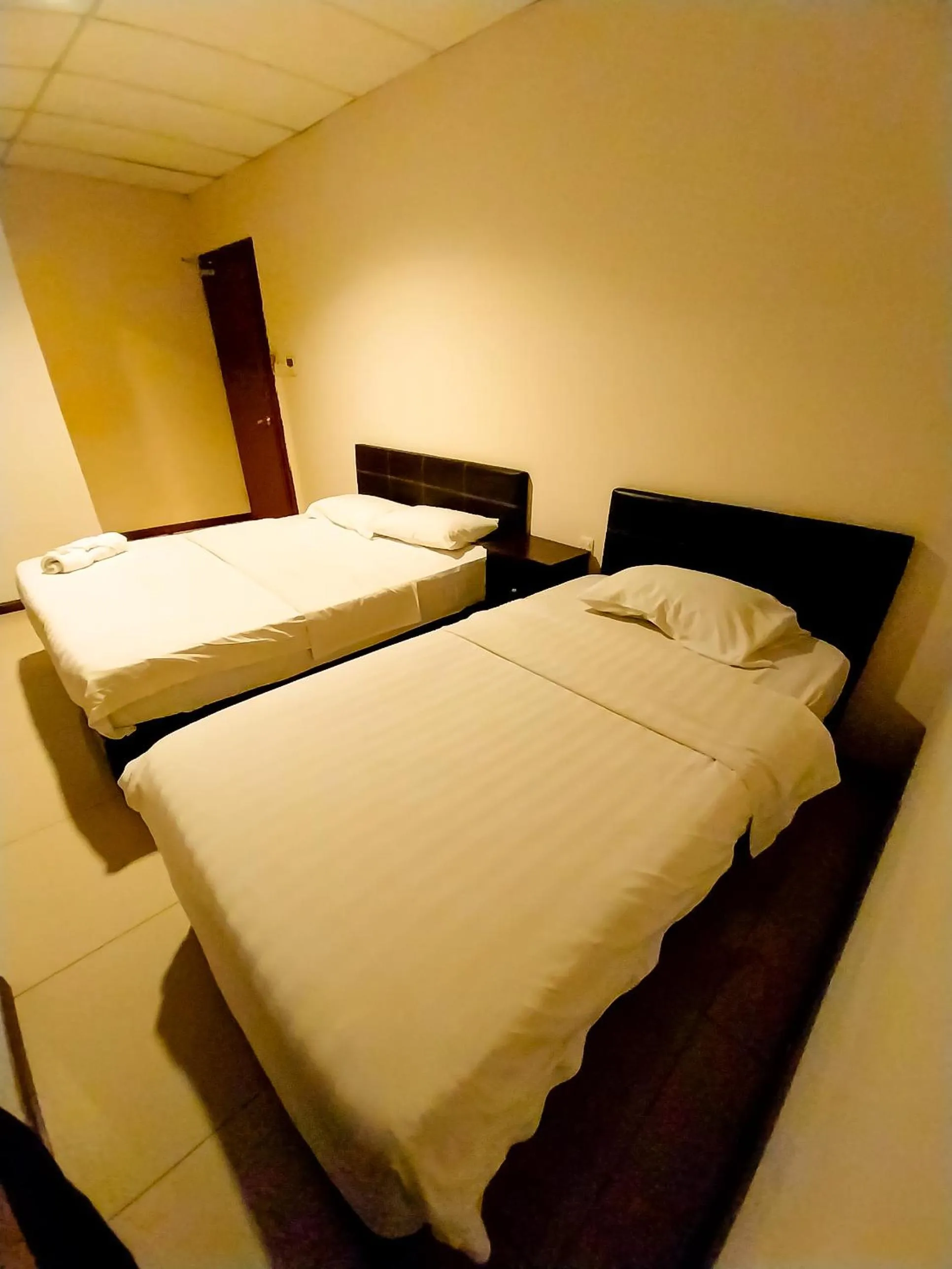Bed in MB Budget Hotel
