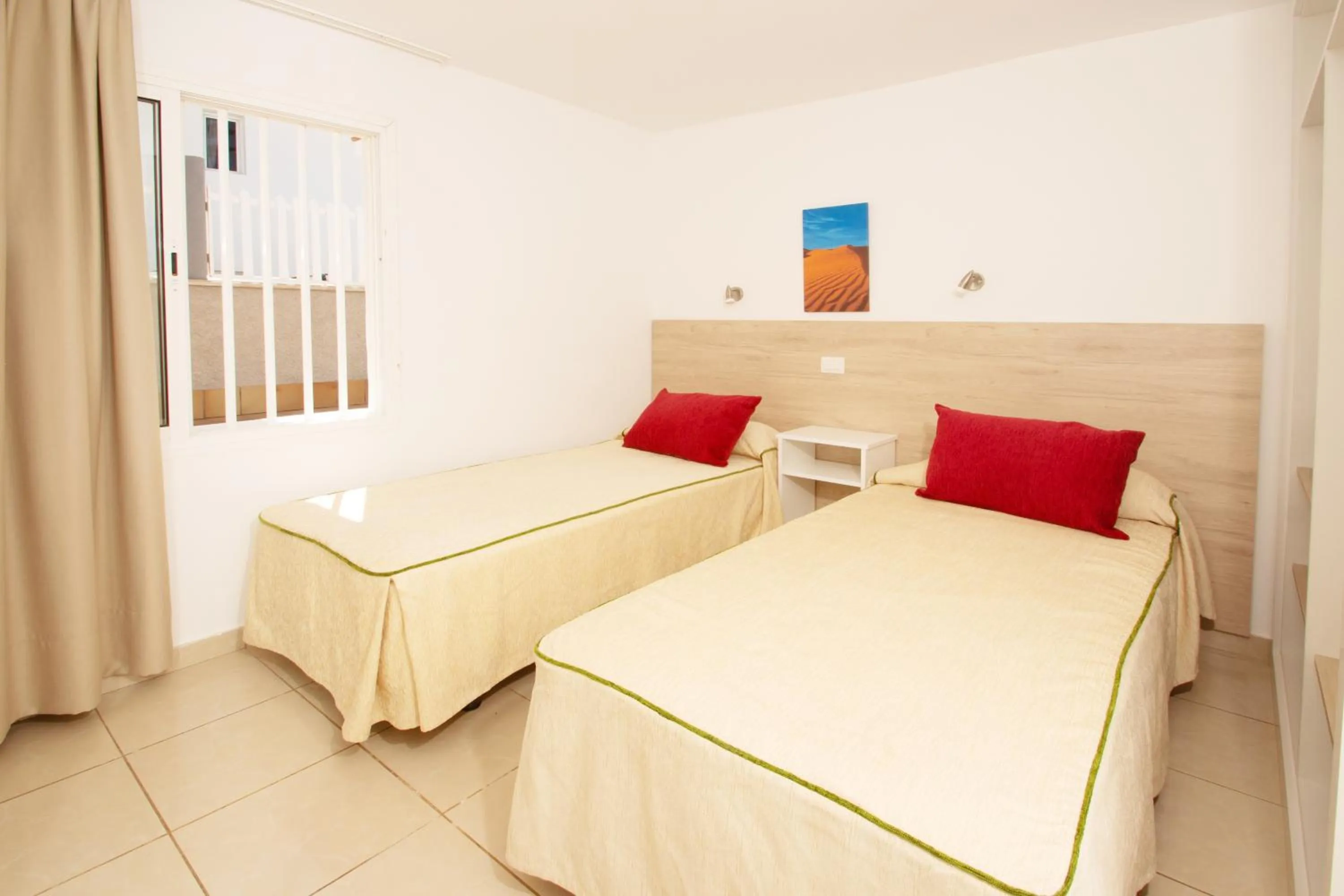 Bed in Apartamentos Cocoteros