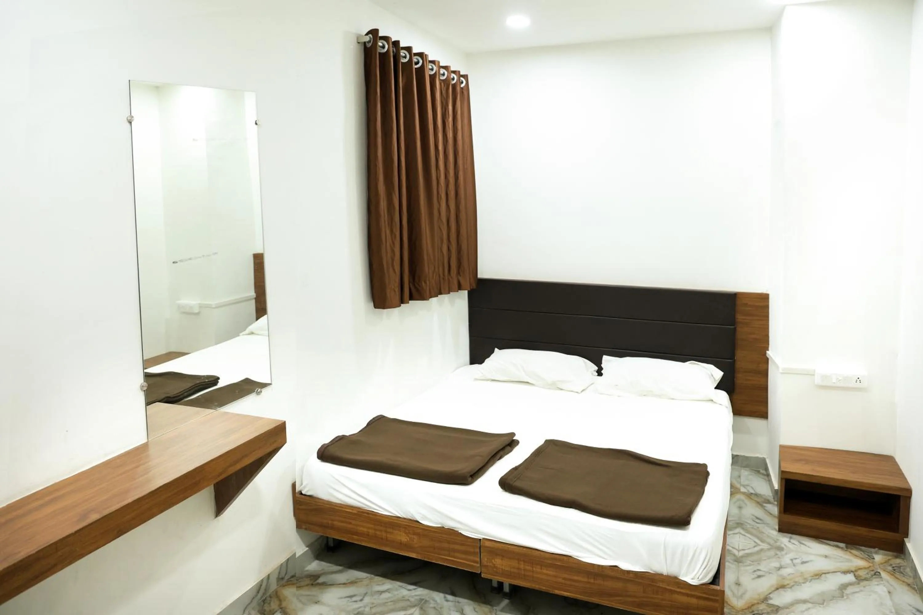 Bed in Hotel Aaram Kalupur