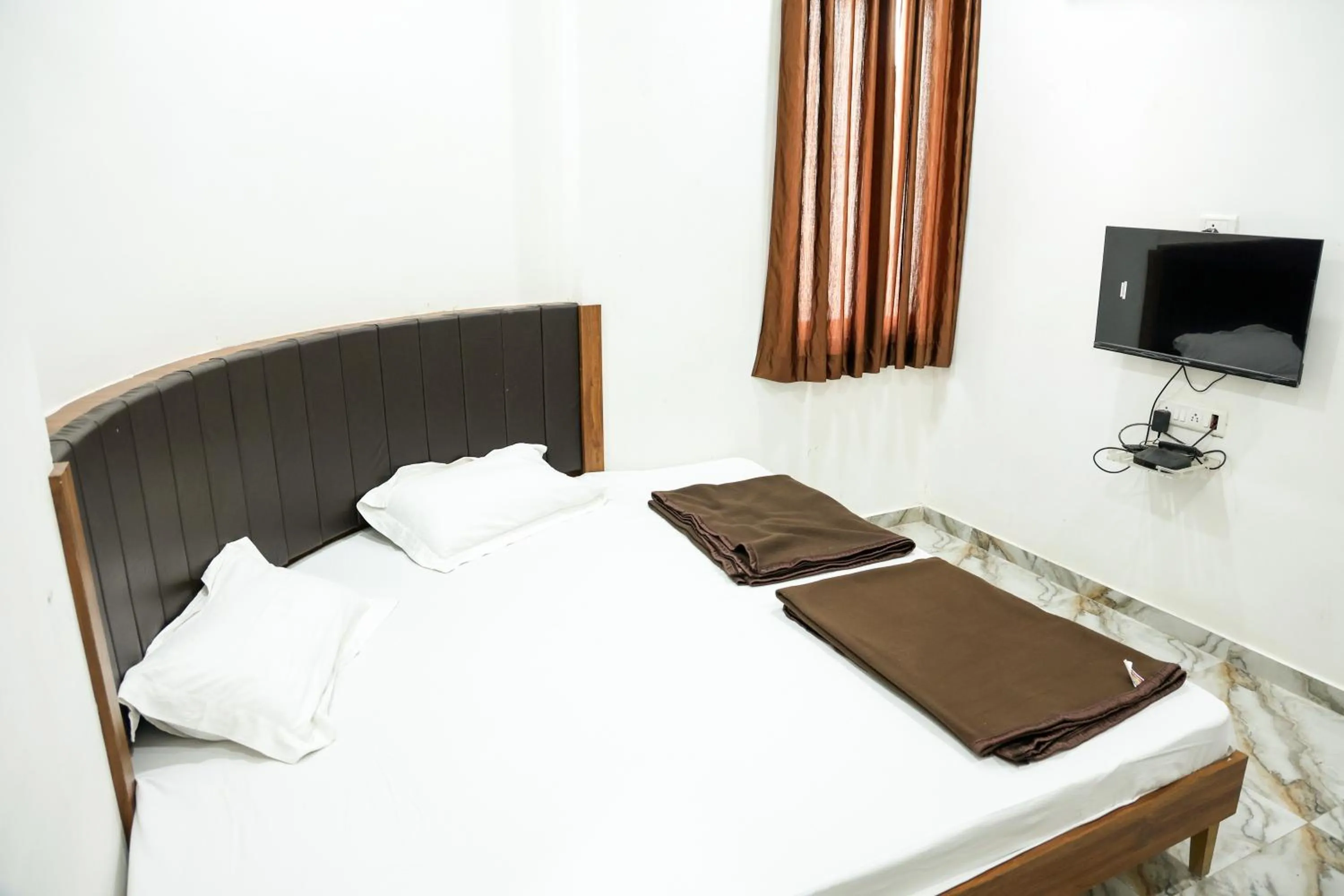 Bed in Hotel Aaram Kalupur