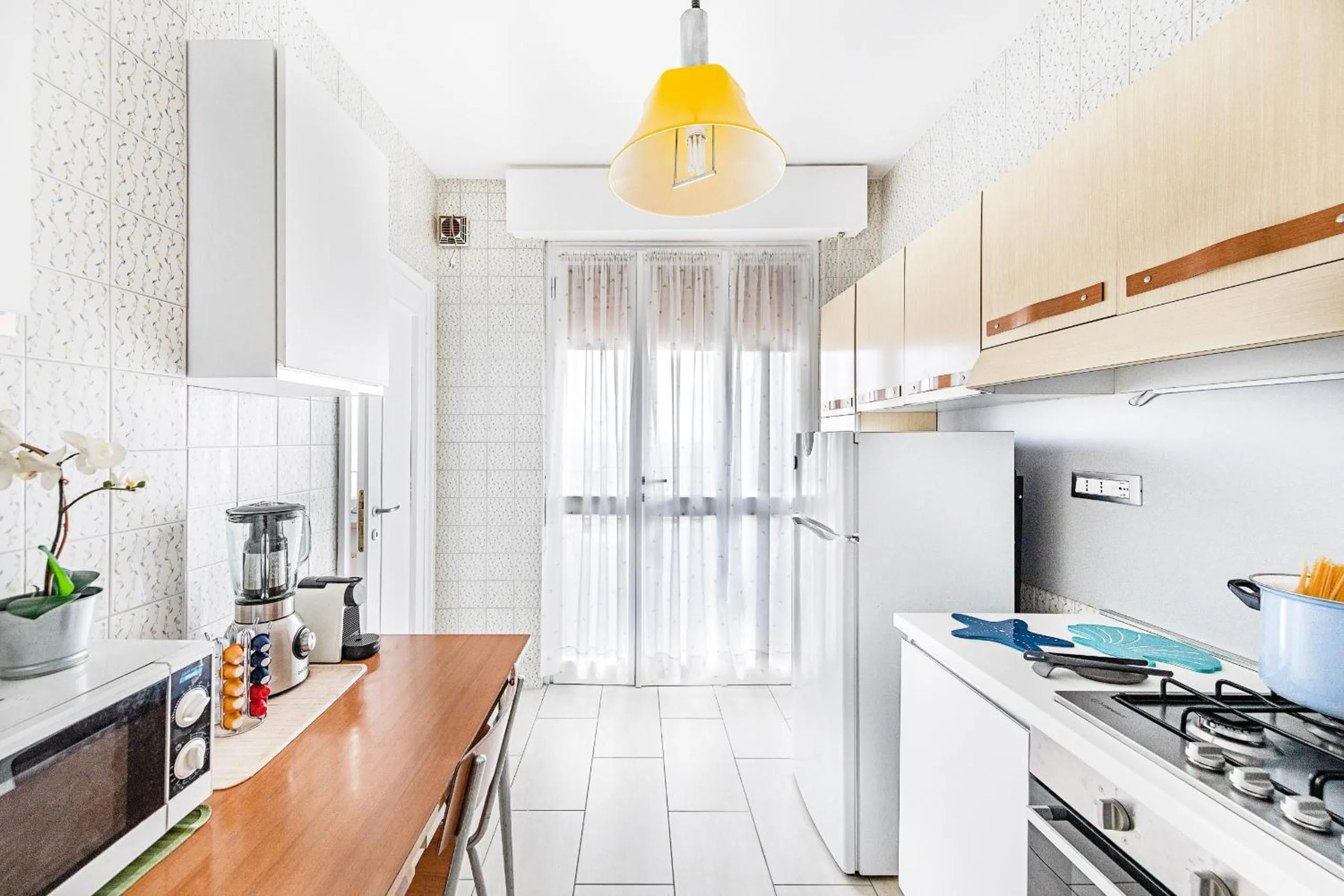 Kitchen or kitchenette in Le Orchidee 19 by Wonderful Italy