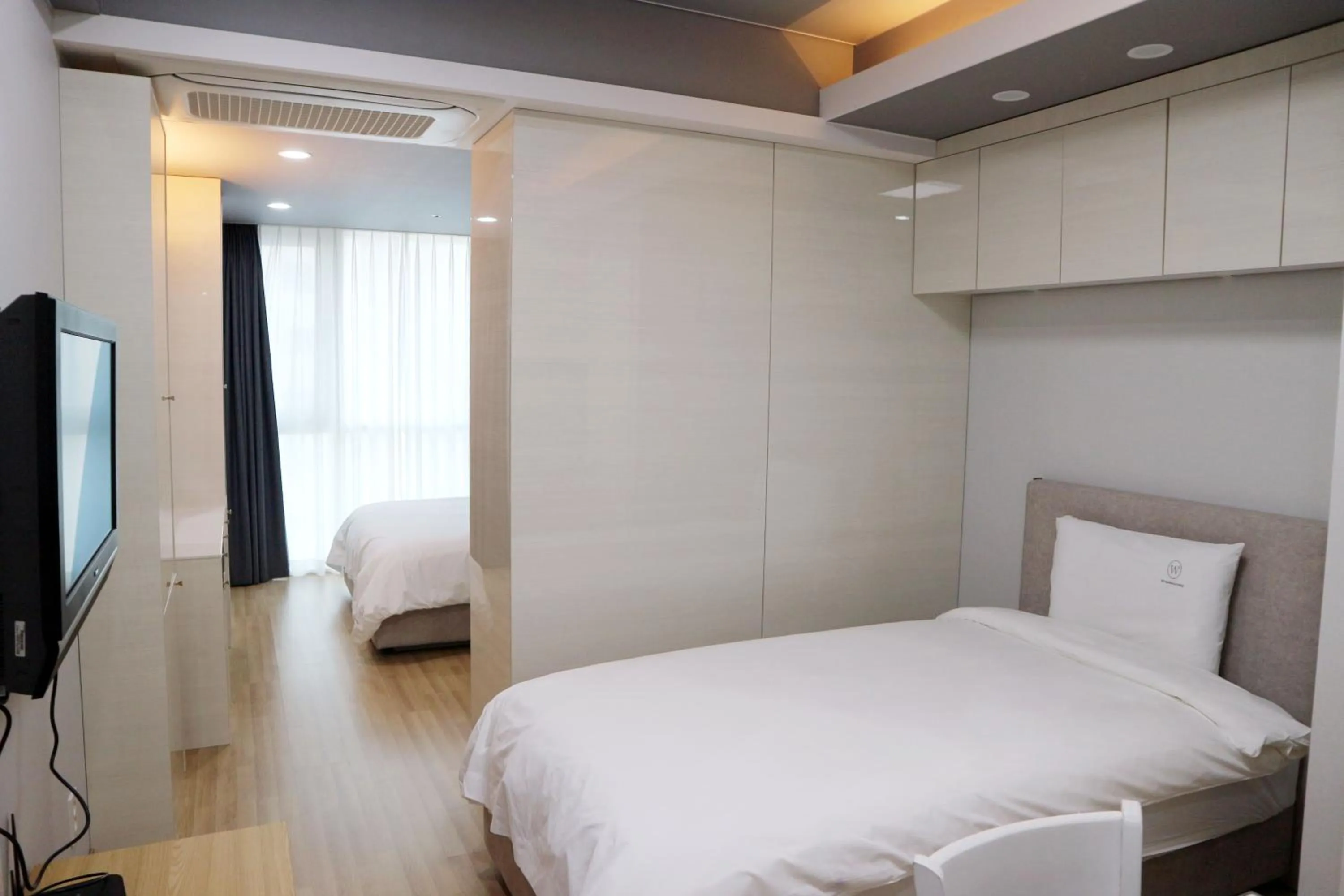 Bed in W Residence Hotel Centum City