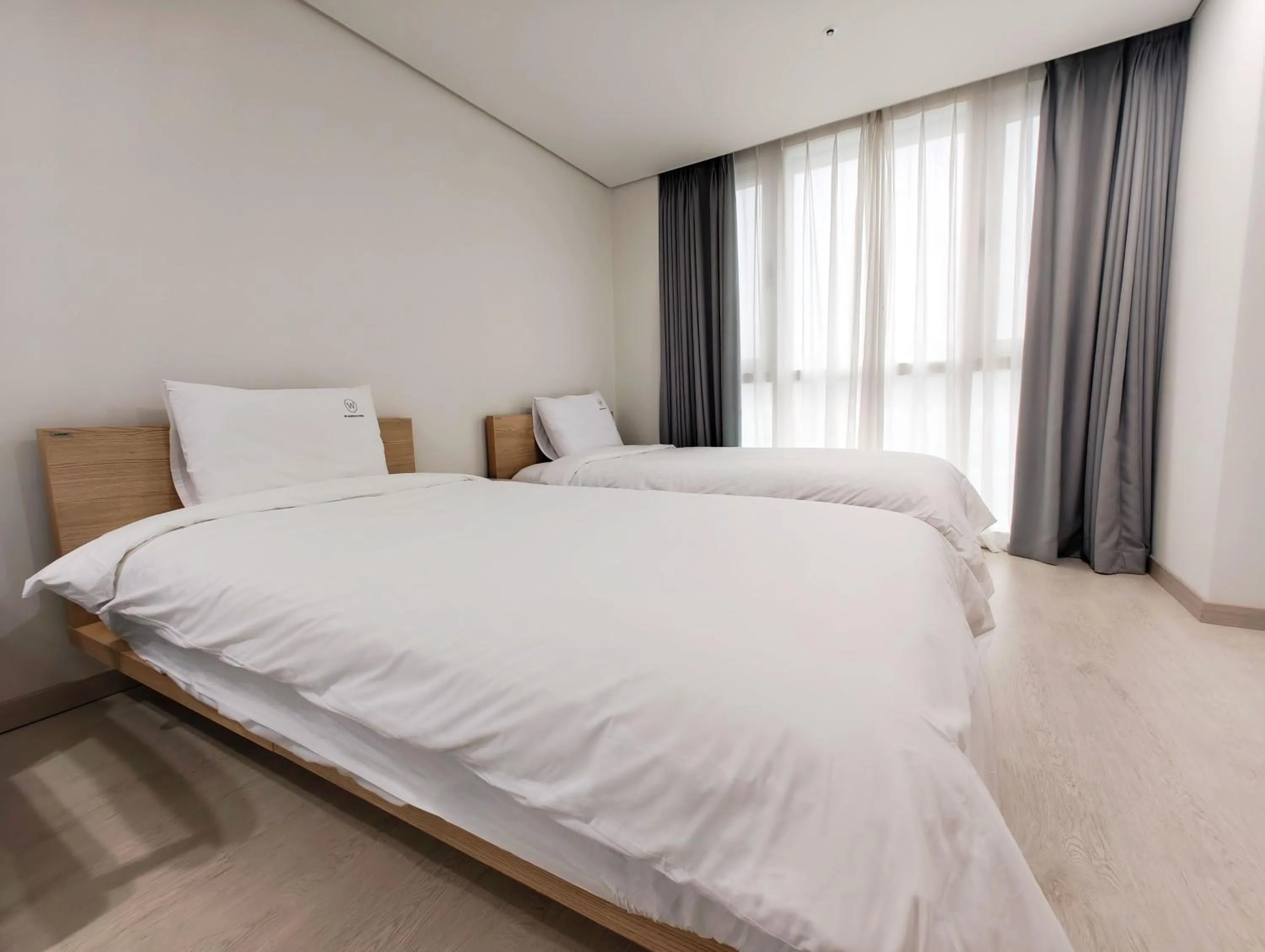 Bed in W Residence Hotel Centum City