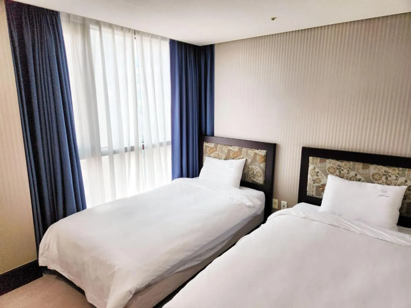 Bed in W Residence Hotel Centum City