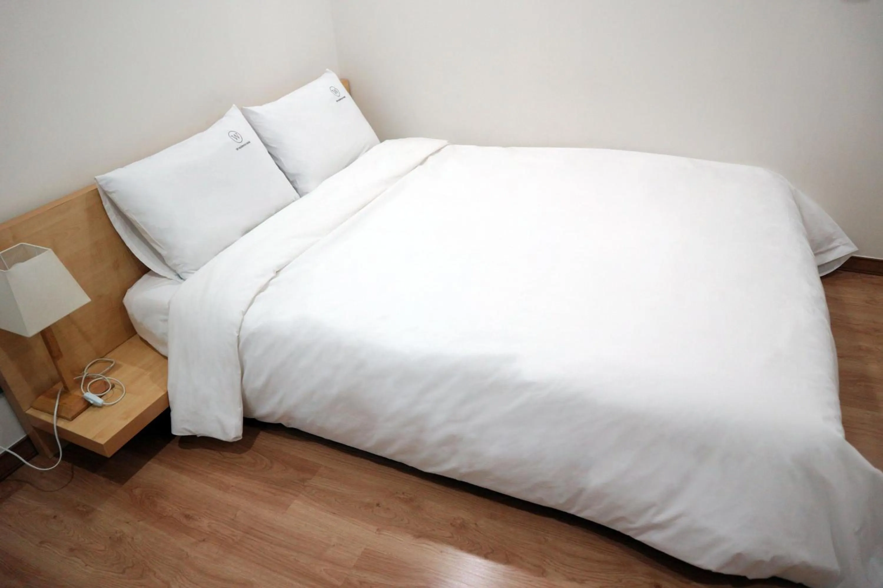 Bed in W Residence Hotel Centum City