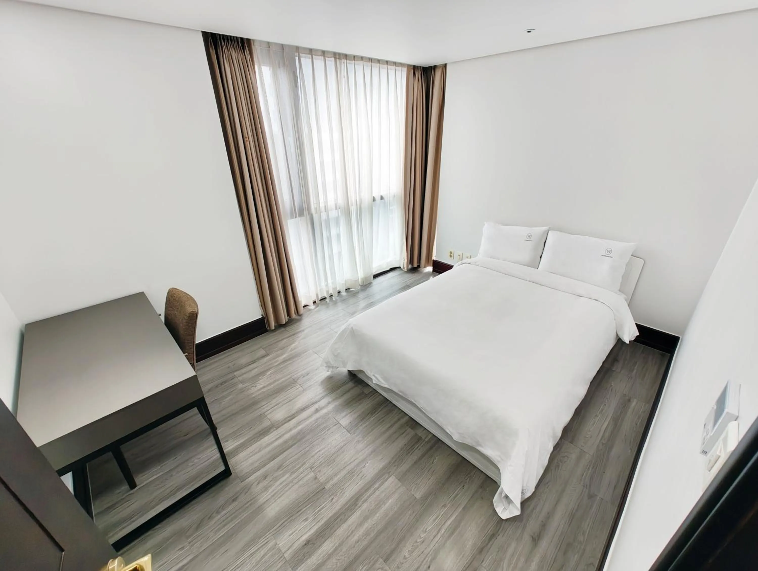 Bed in W Residence Hotel Centum City