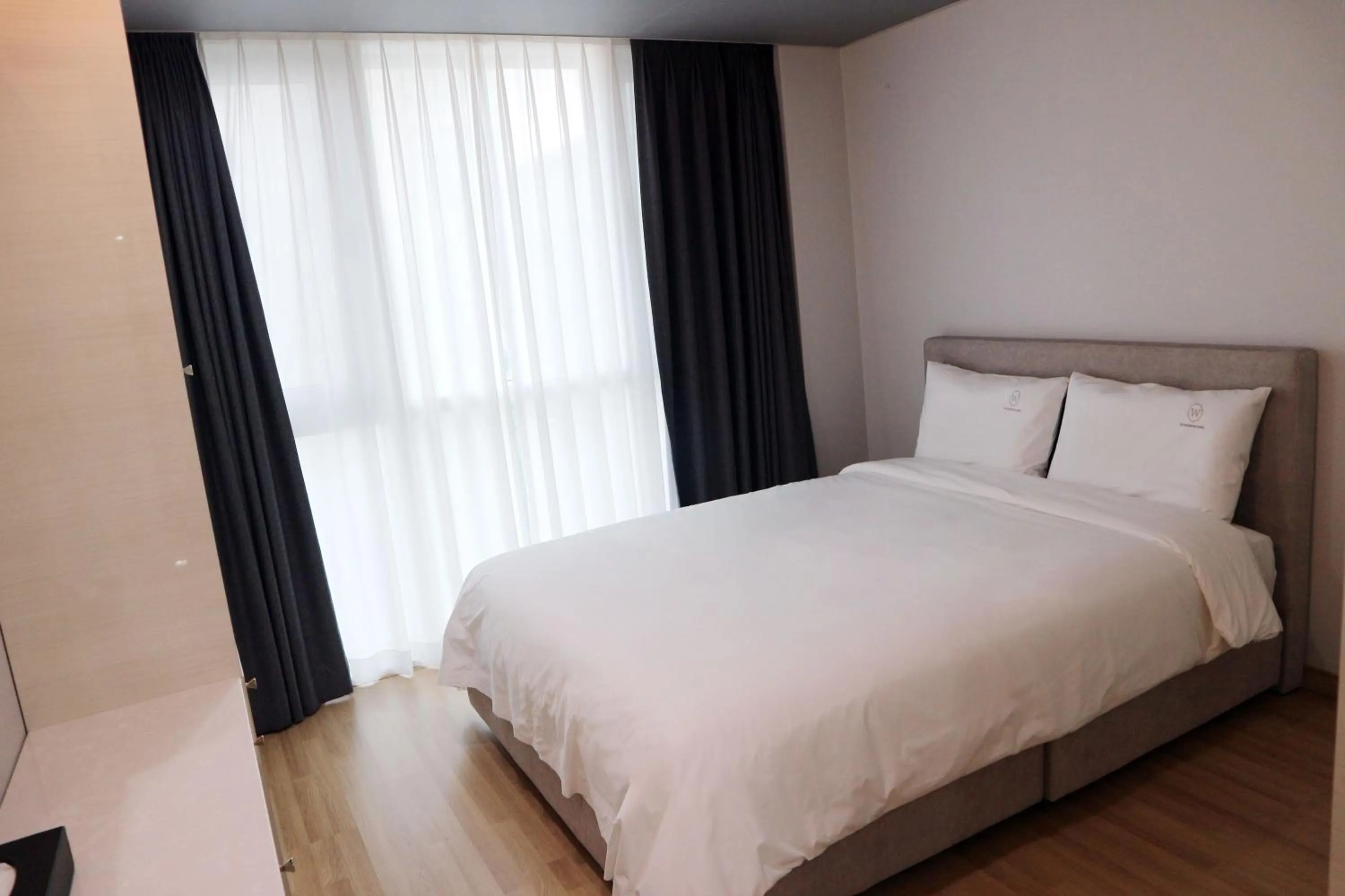 Bed in W Residence Hotel Centum City