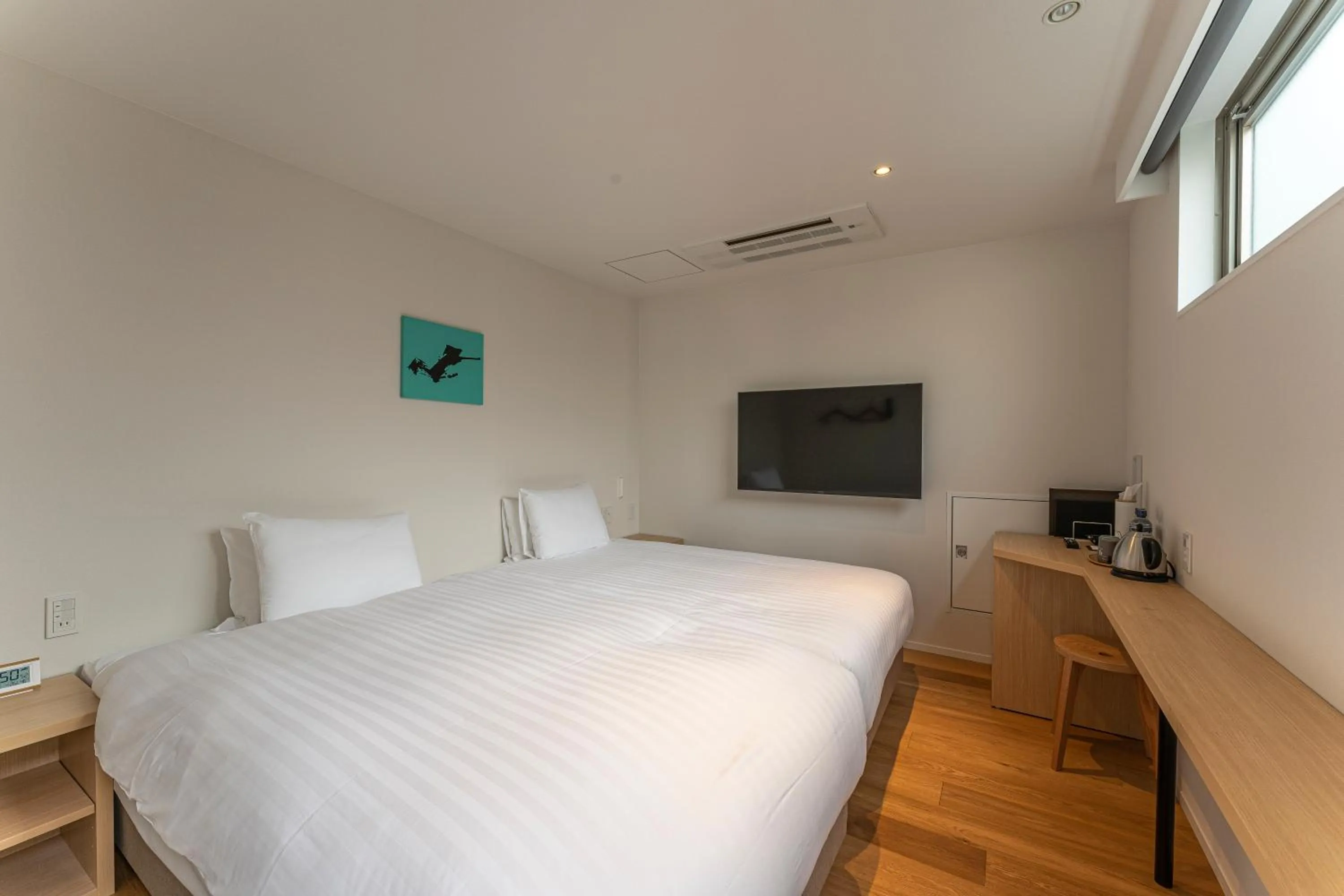 Bed in 9HOTEL Tenjin