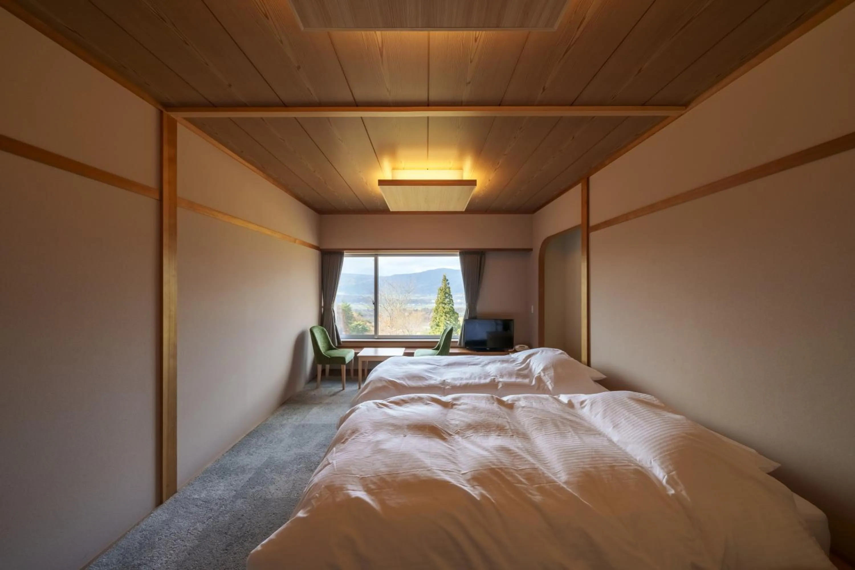 Bed in HOKURYUKO HOTEL North NAGANO