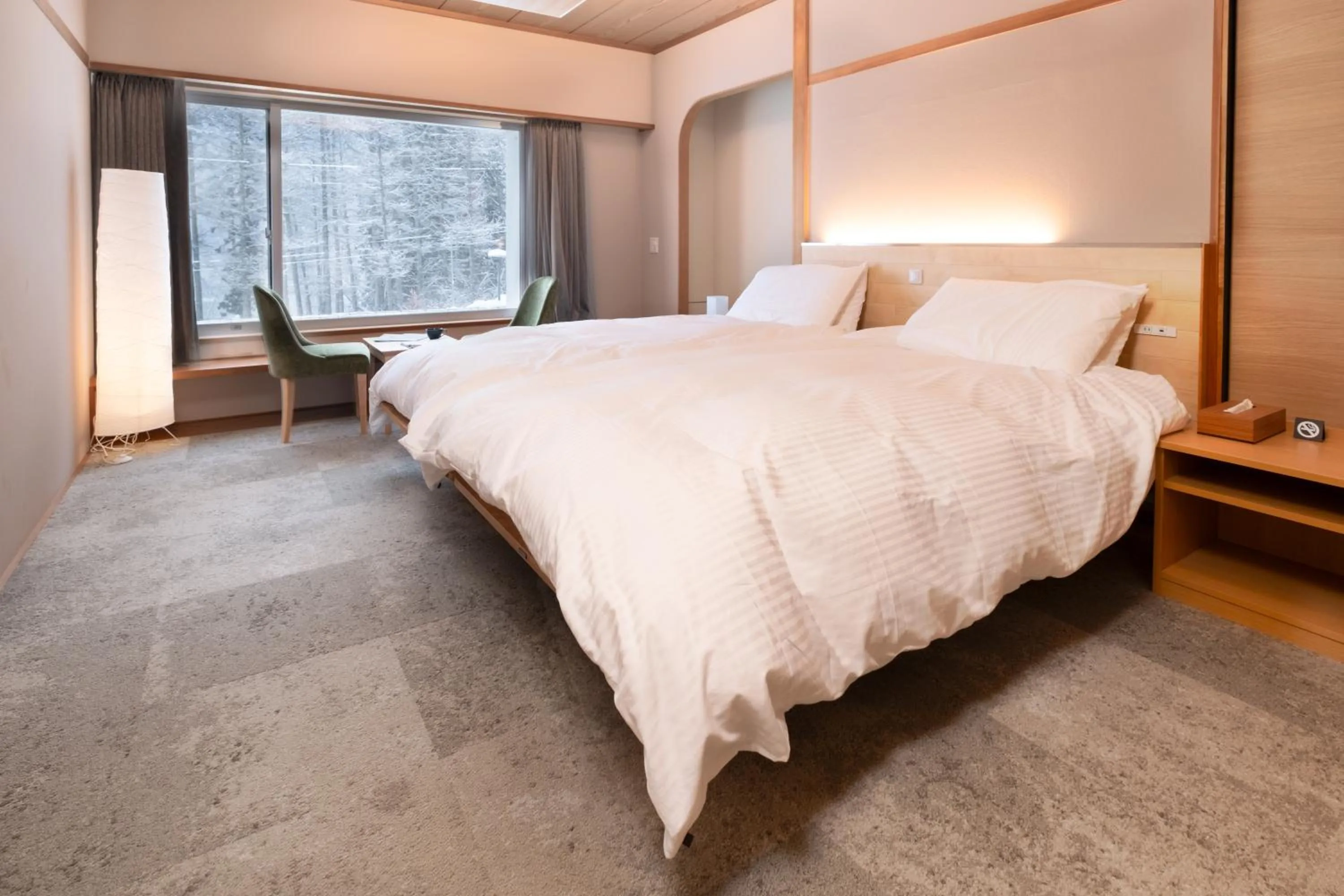 Bed in HOKURYUKO HOTEL North NAGANO