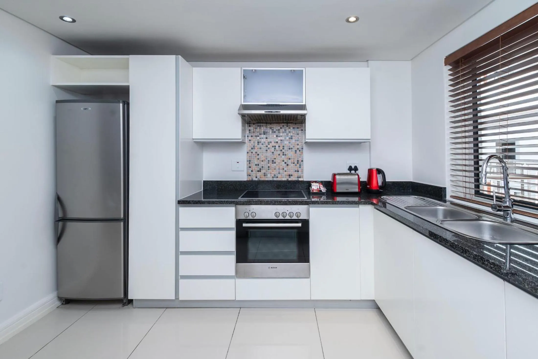 Kitchen or kitchenette in Xenia Aparthotel by Totalstay