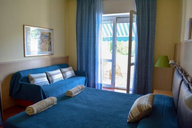 Bed in Il Tridente Hotel