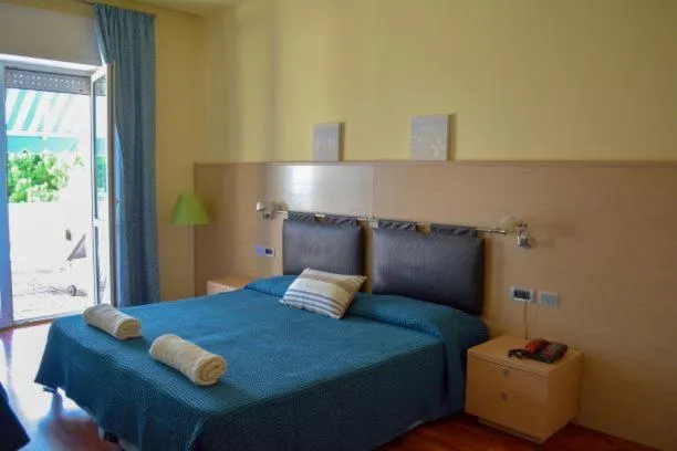 Bed in Il Tridente Hotel