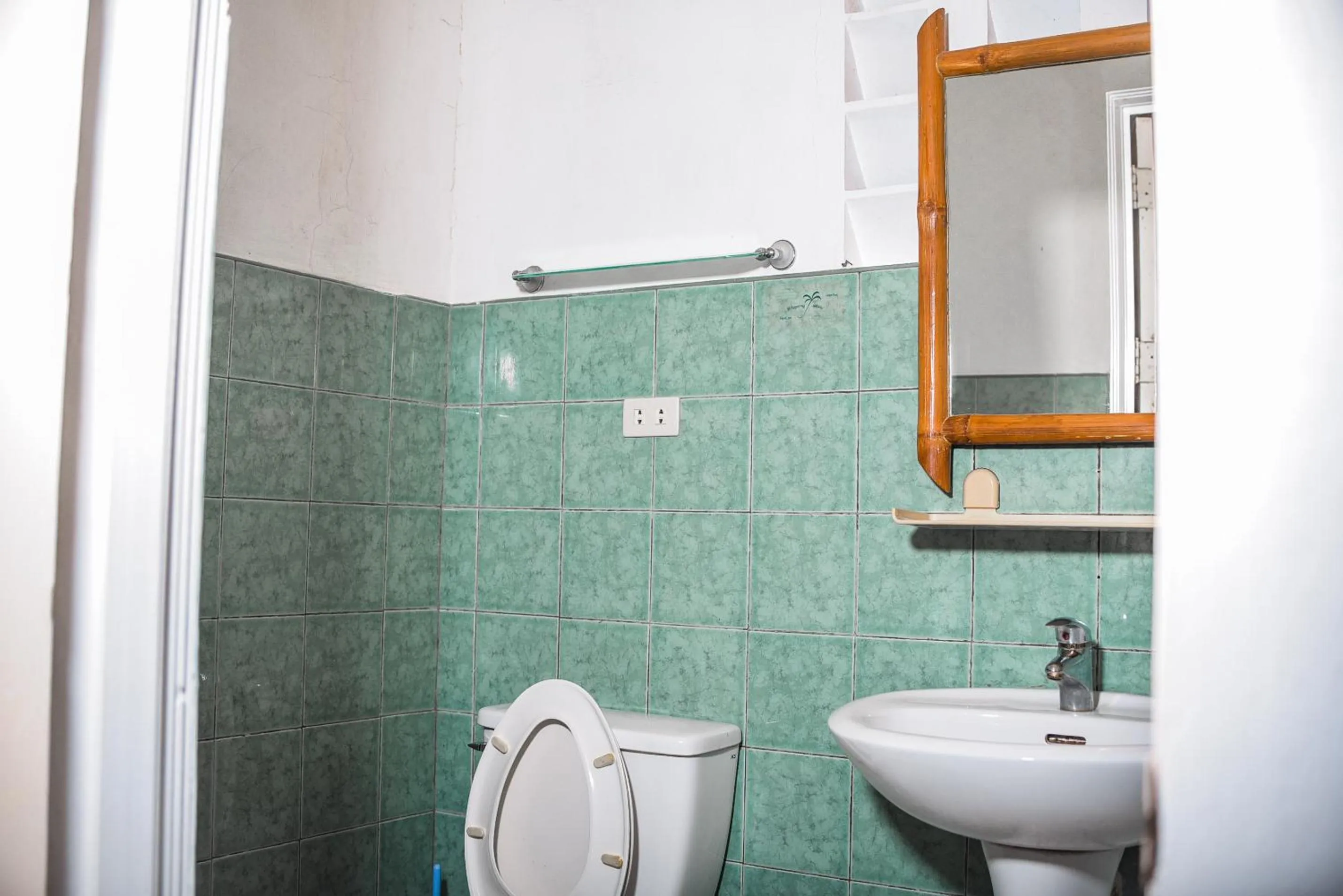 Toilet in Whispering Palms Island Resort