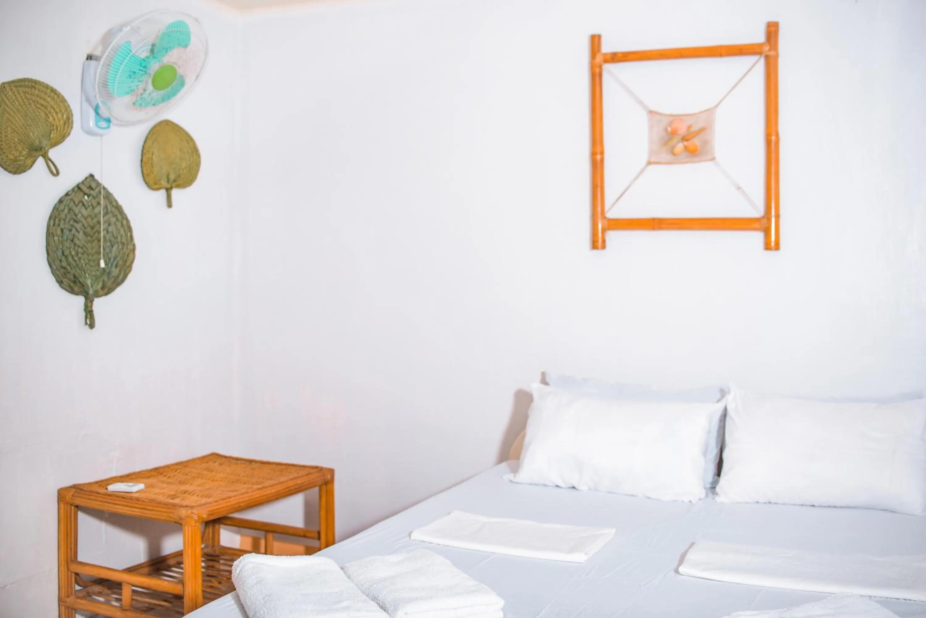 Bed in Whispering Palms Island Resort