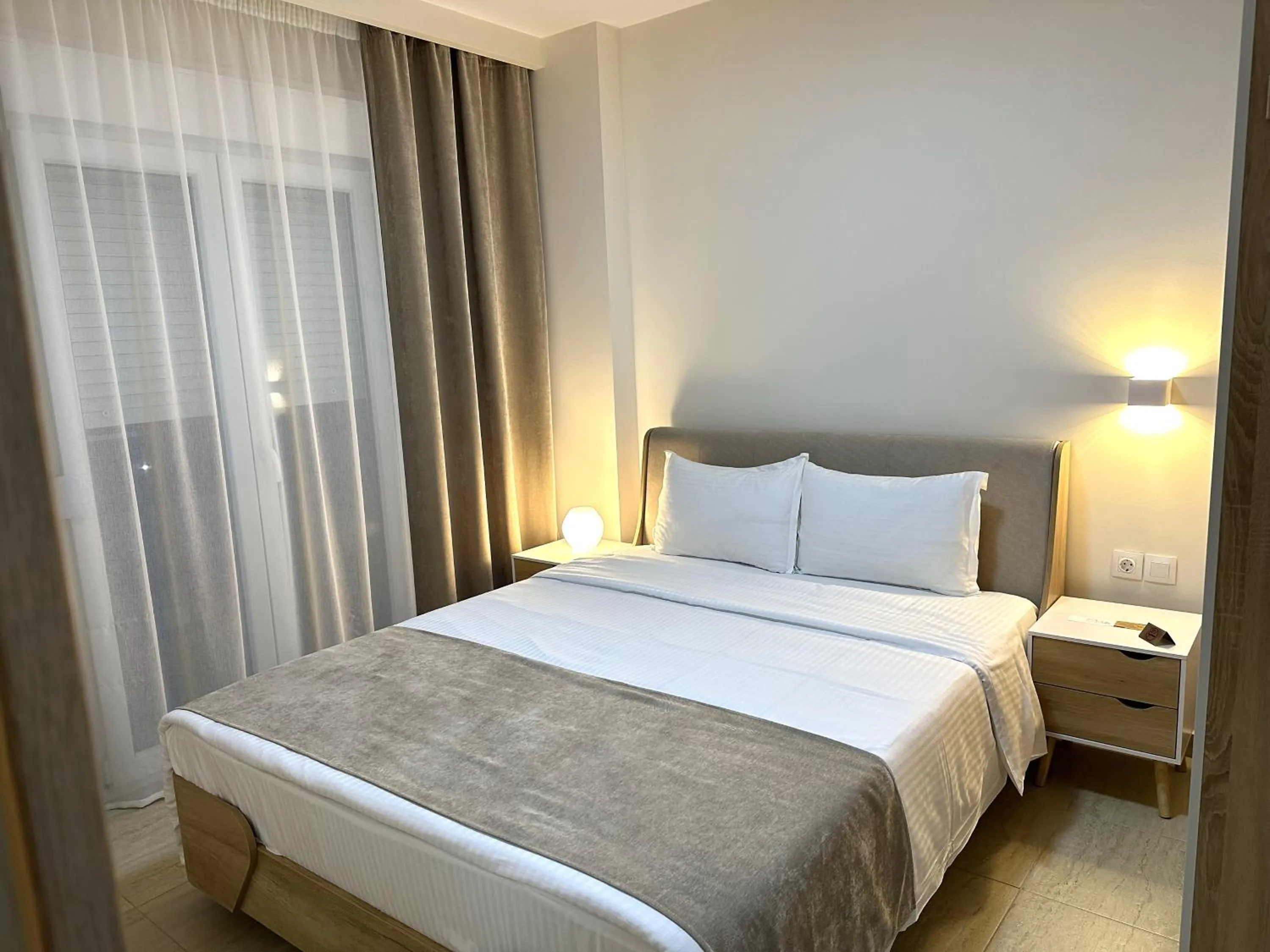 Bed in Navarino Luxe Suites