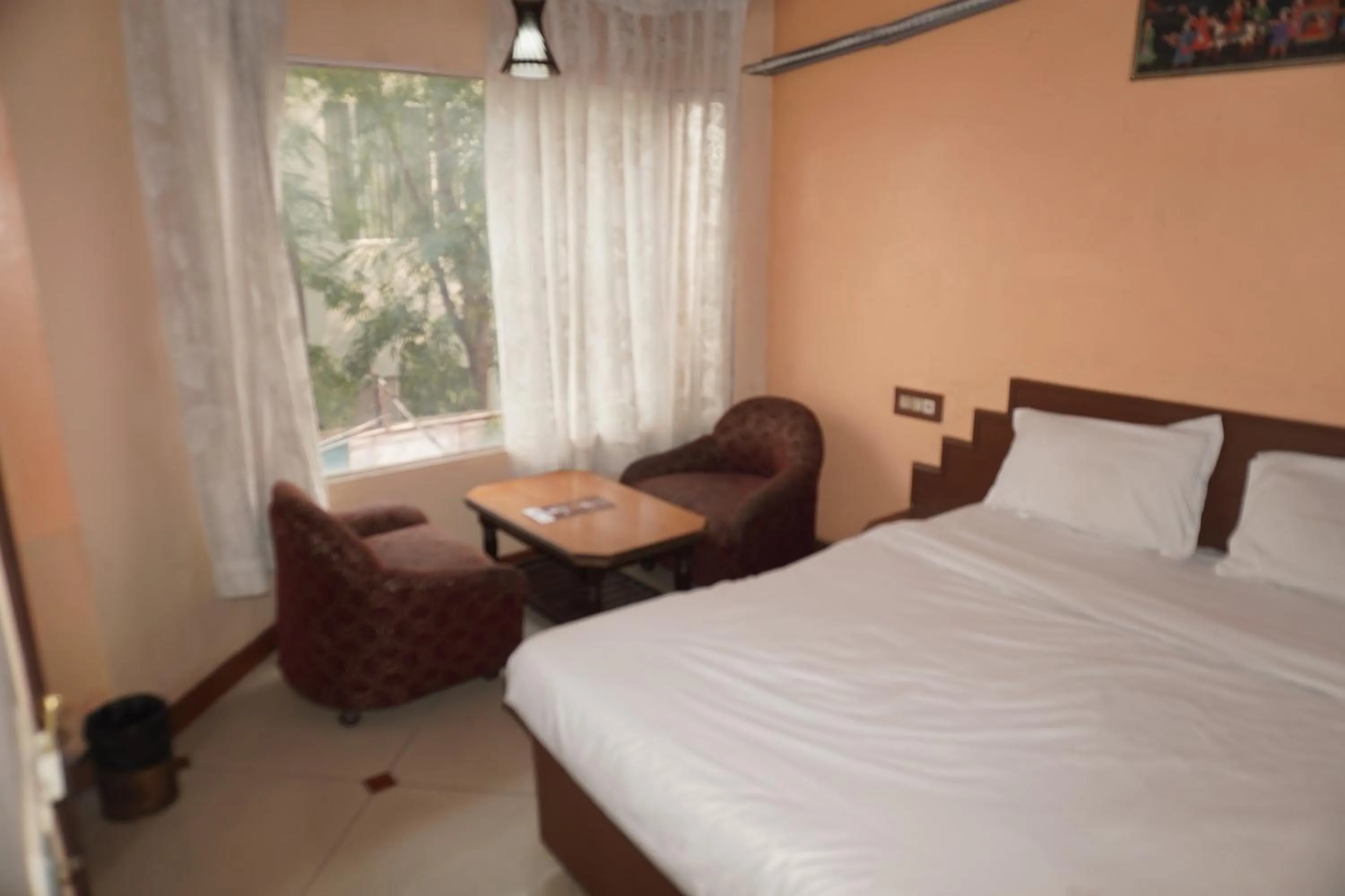 Bed in Hotel Maya international