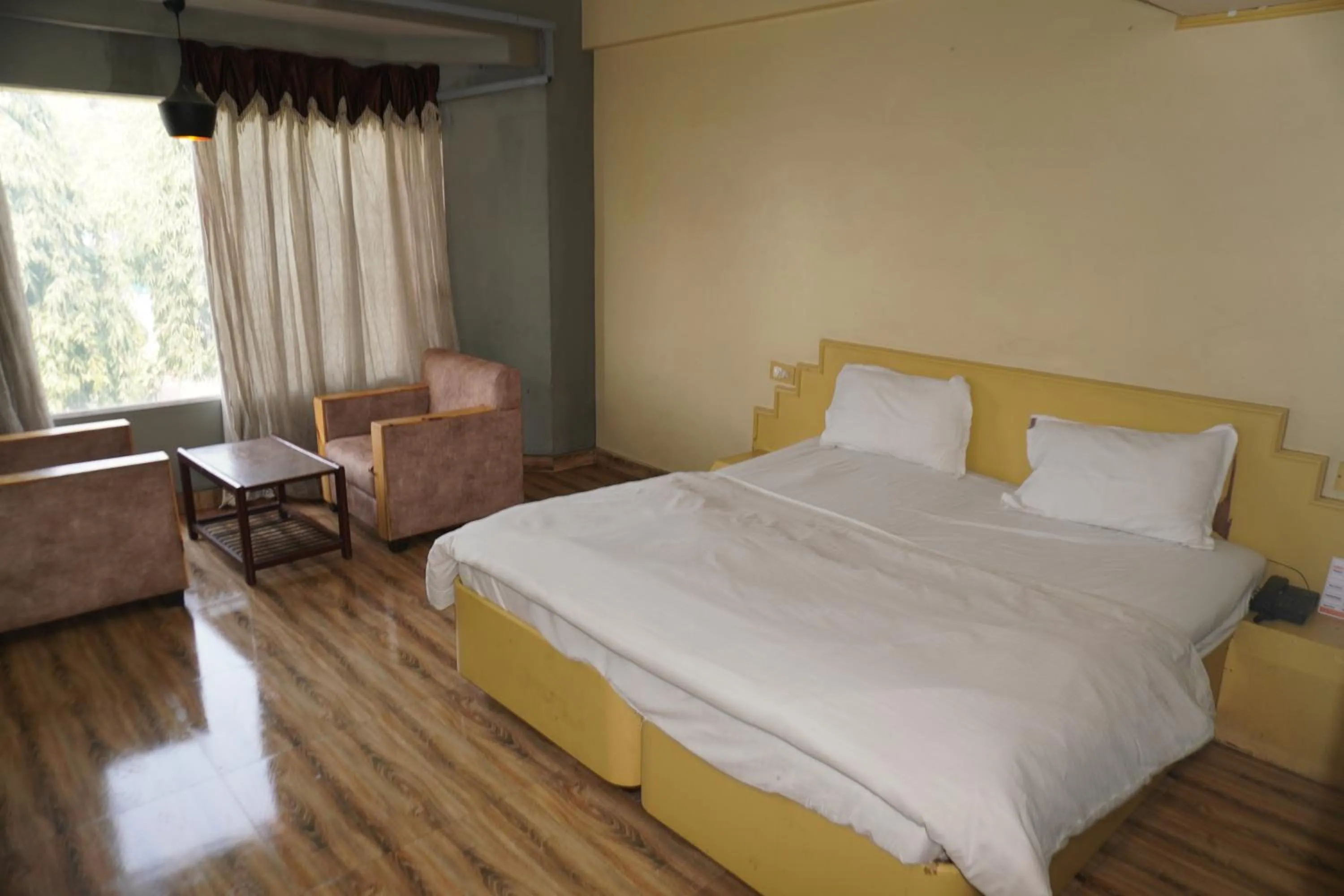 Bed in Hotel Maya international