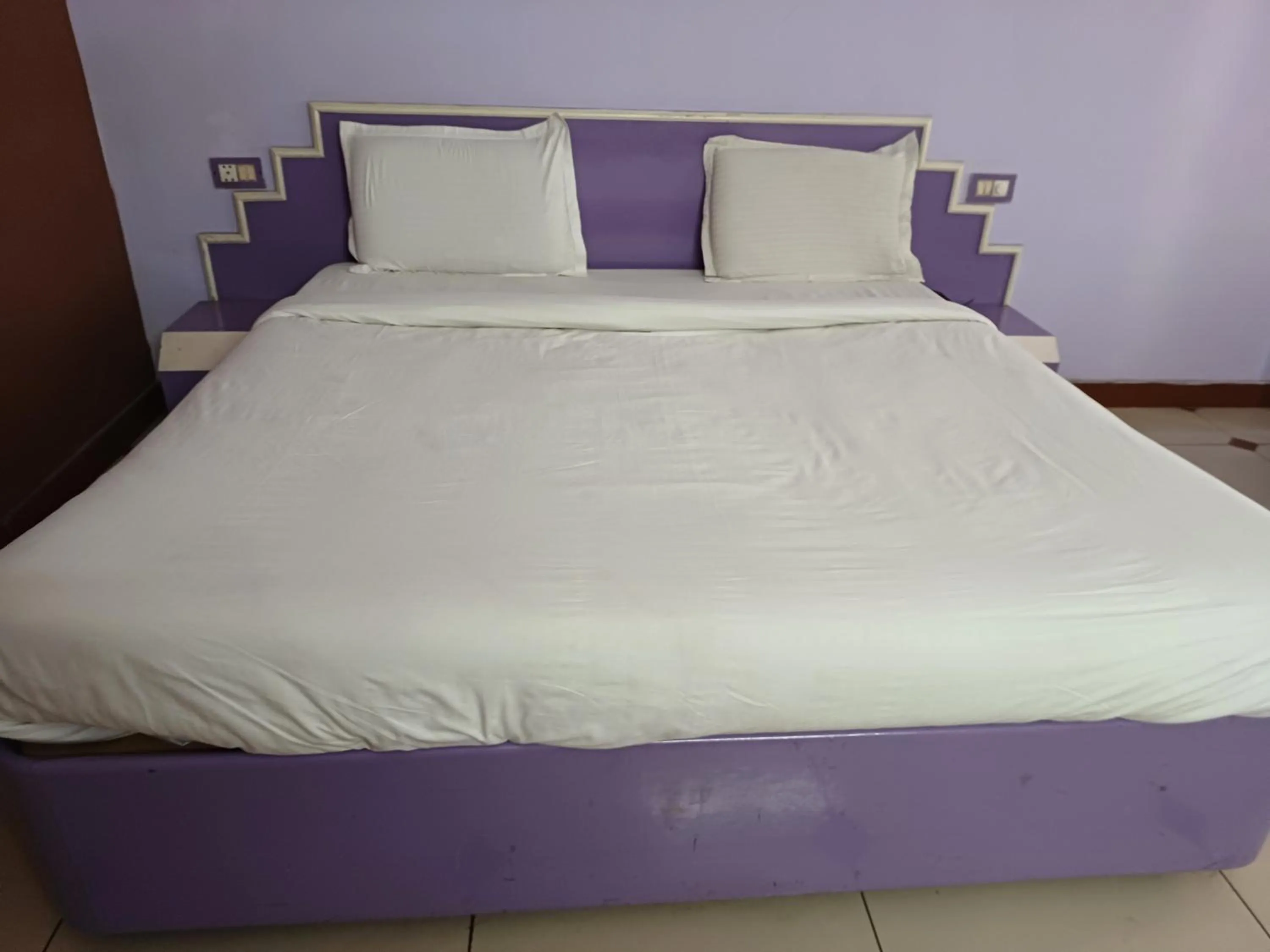 Bed in Hotel Maya international