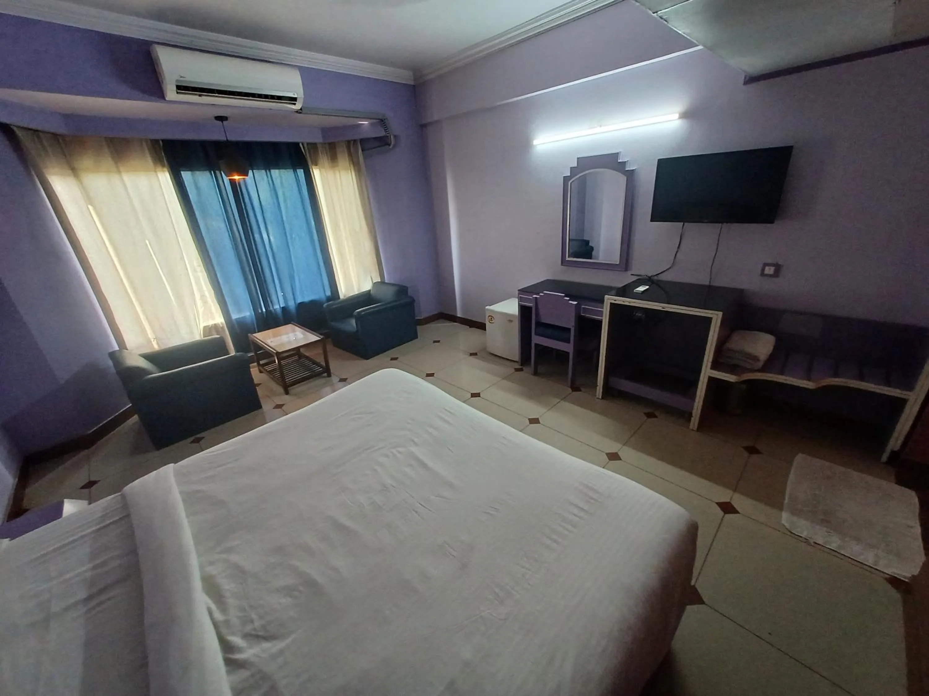 Bed in Hotel Maya international