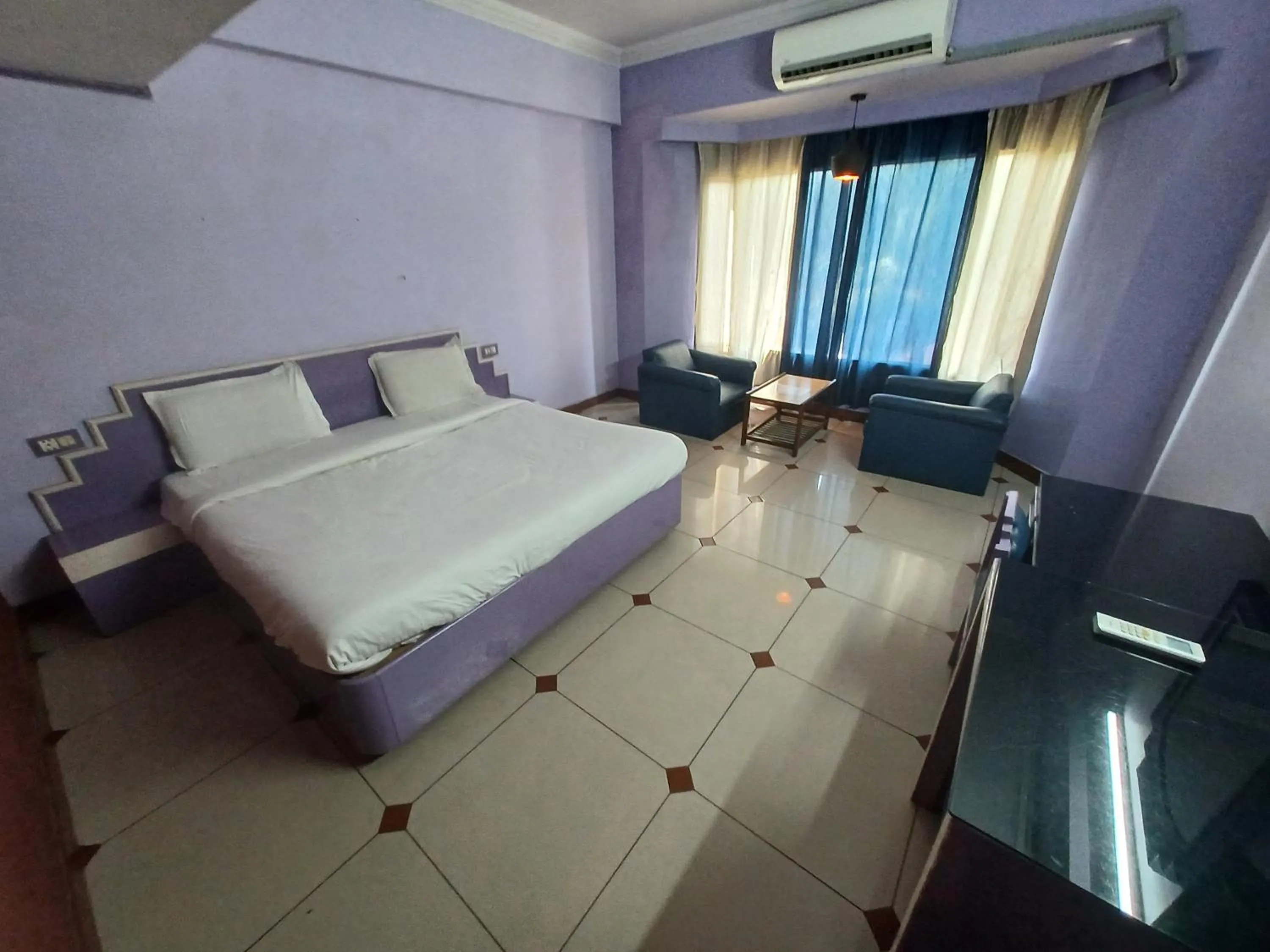 Bed in Hotel Maya international