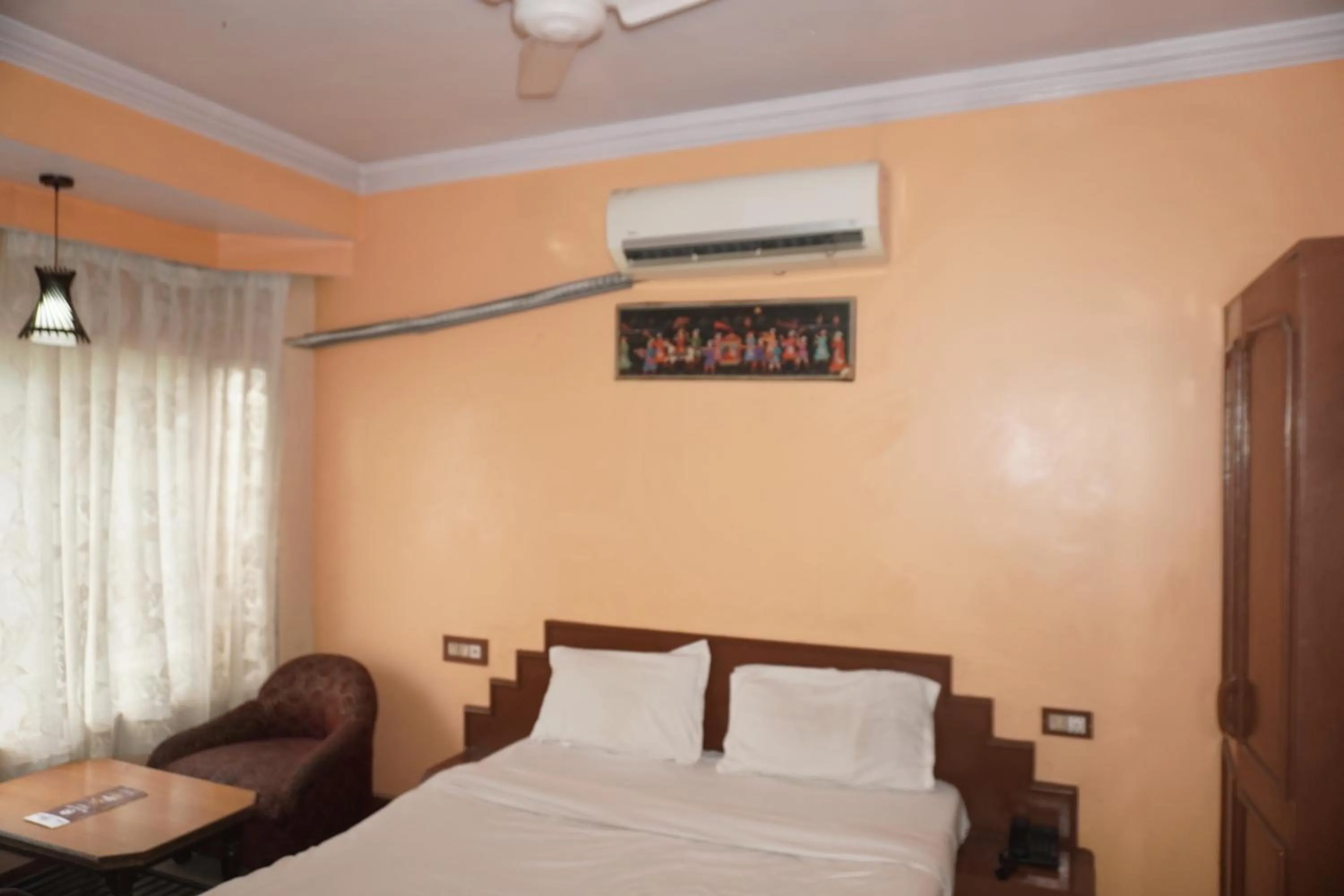 Bed in Hotel Maya international