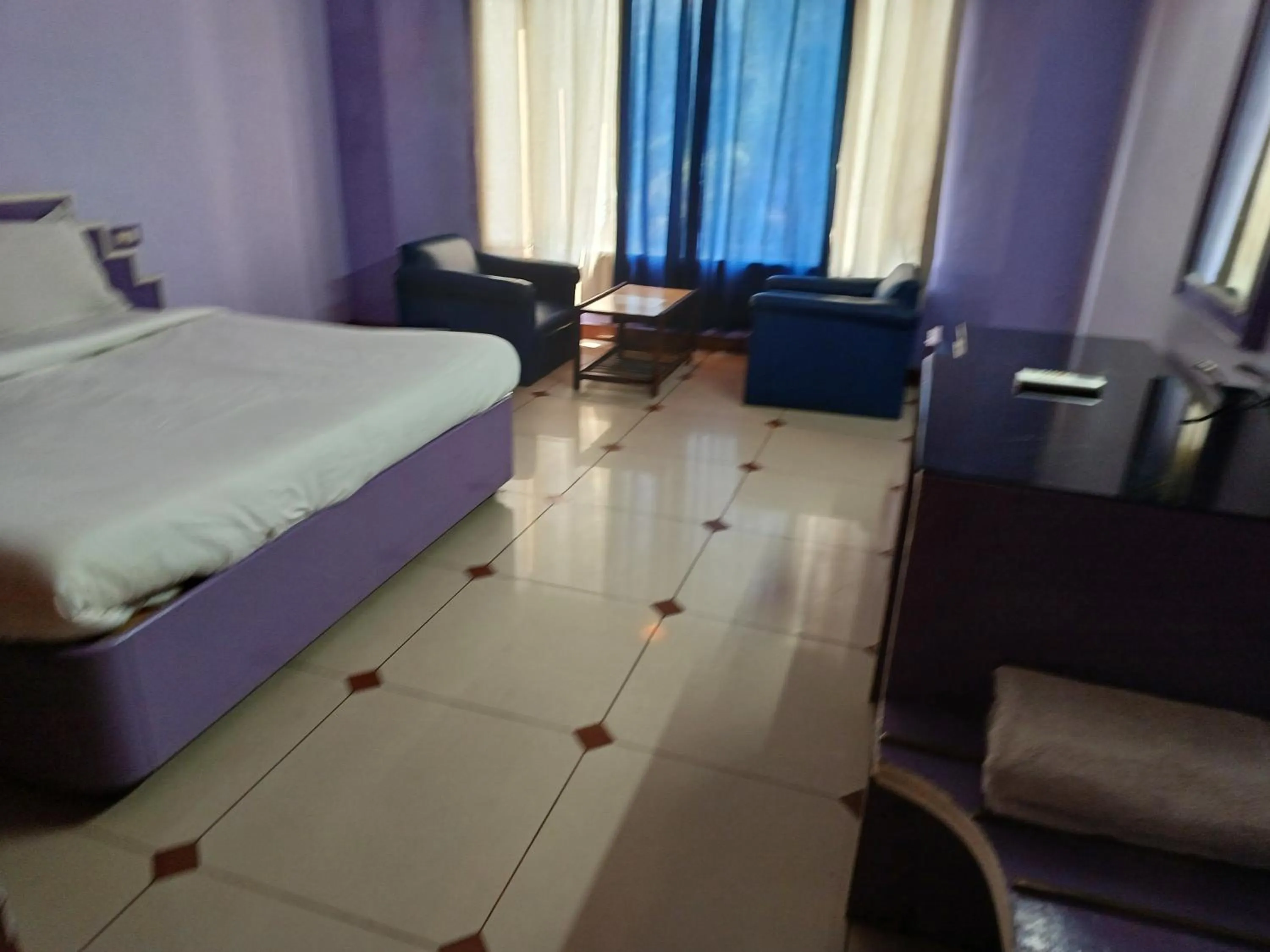 Bed in Hotel Maya international