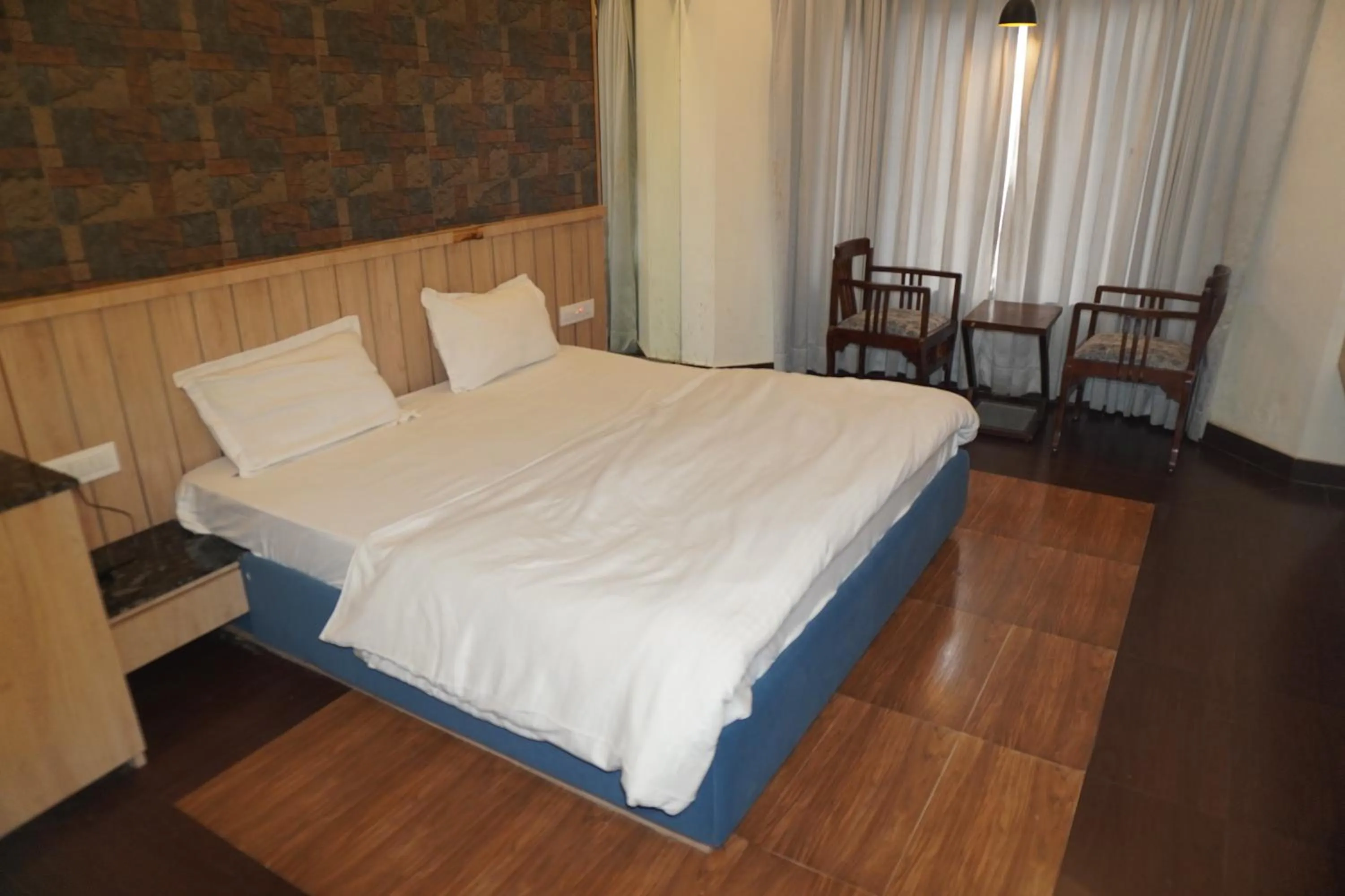 Bed in Hotel Maya international