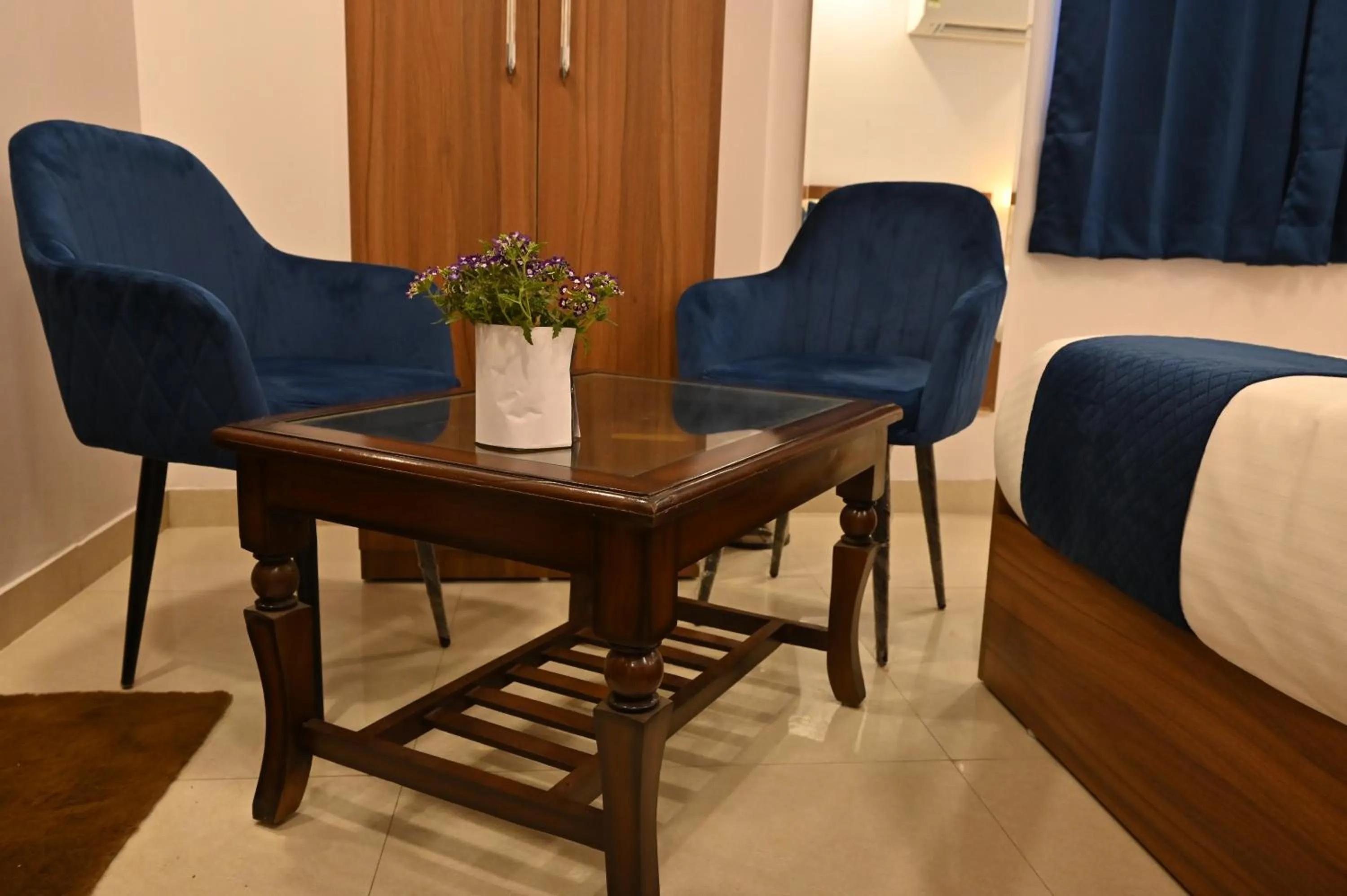 Seating area, Bed in Hotel Down Town Paschim Vihar