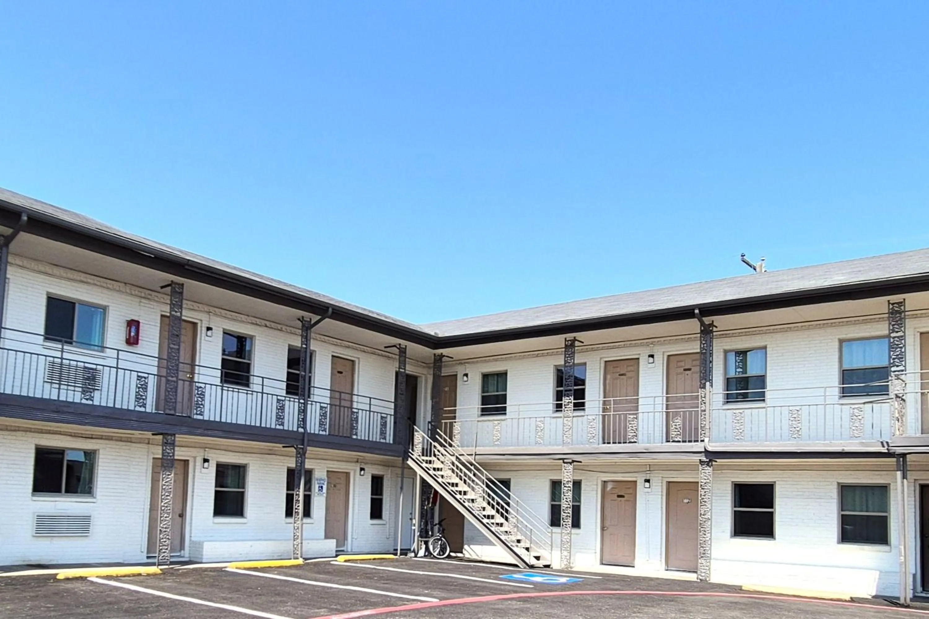 Property building in Exclusivo Inn by OYO Grand Prairie, TX