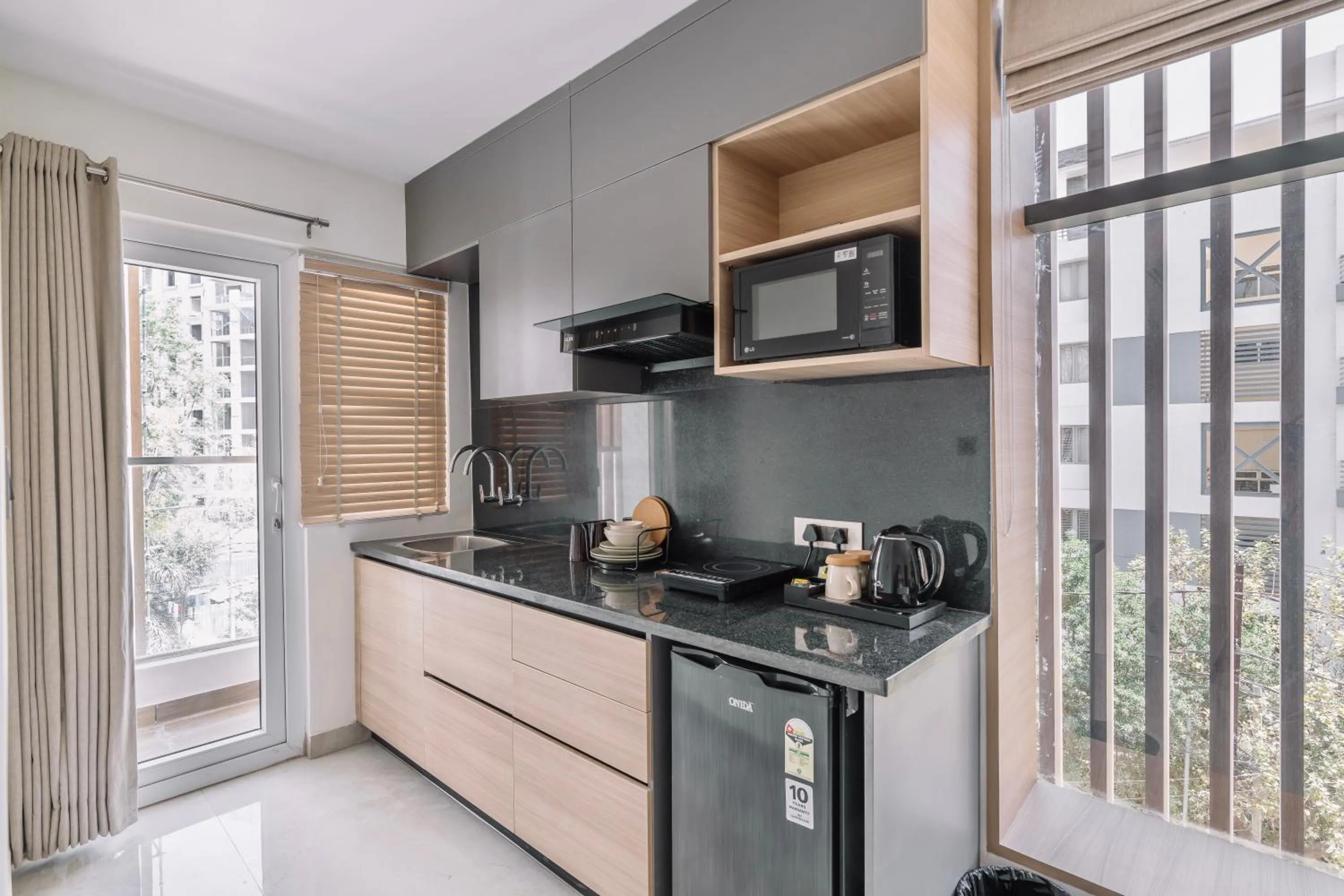Kitchen or kitchenette in SKYLA Studios & Suites - Kondapur