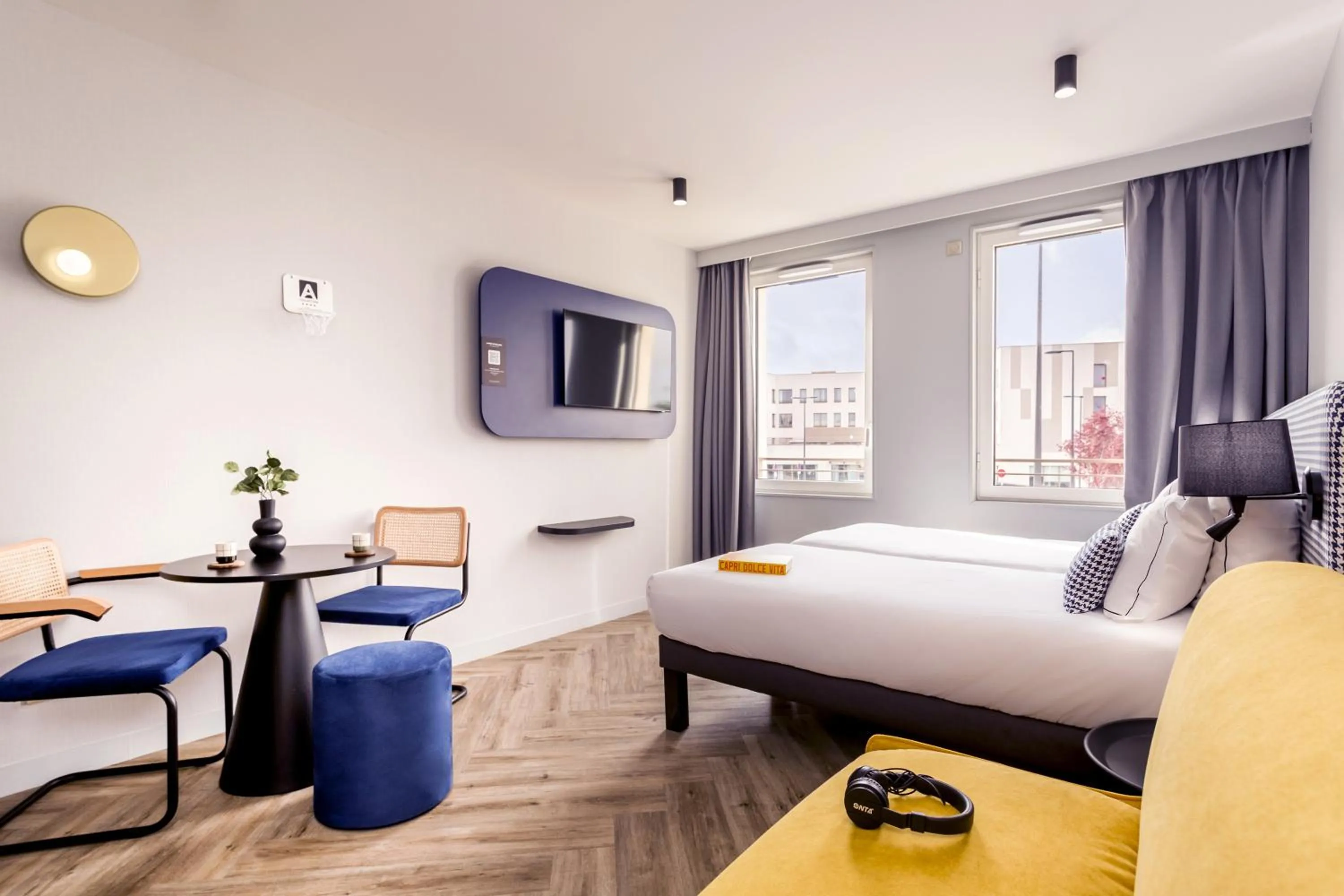 Bed in Appart'City Collection Paris Roissy CDG Airport