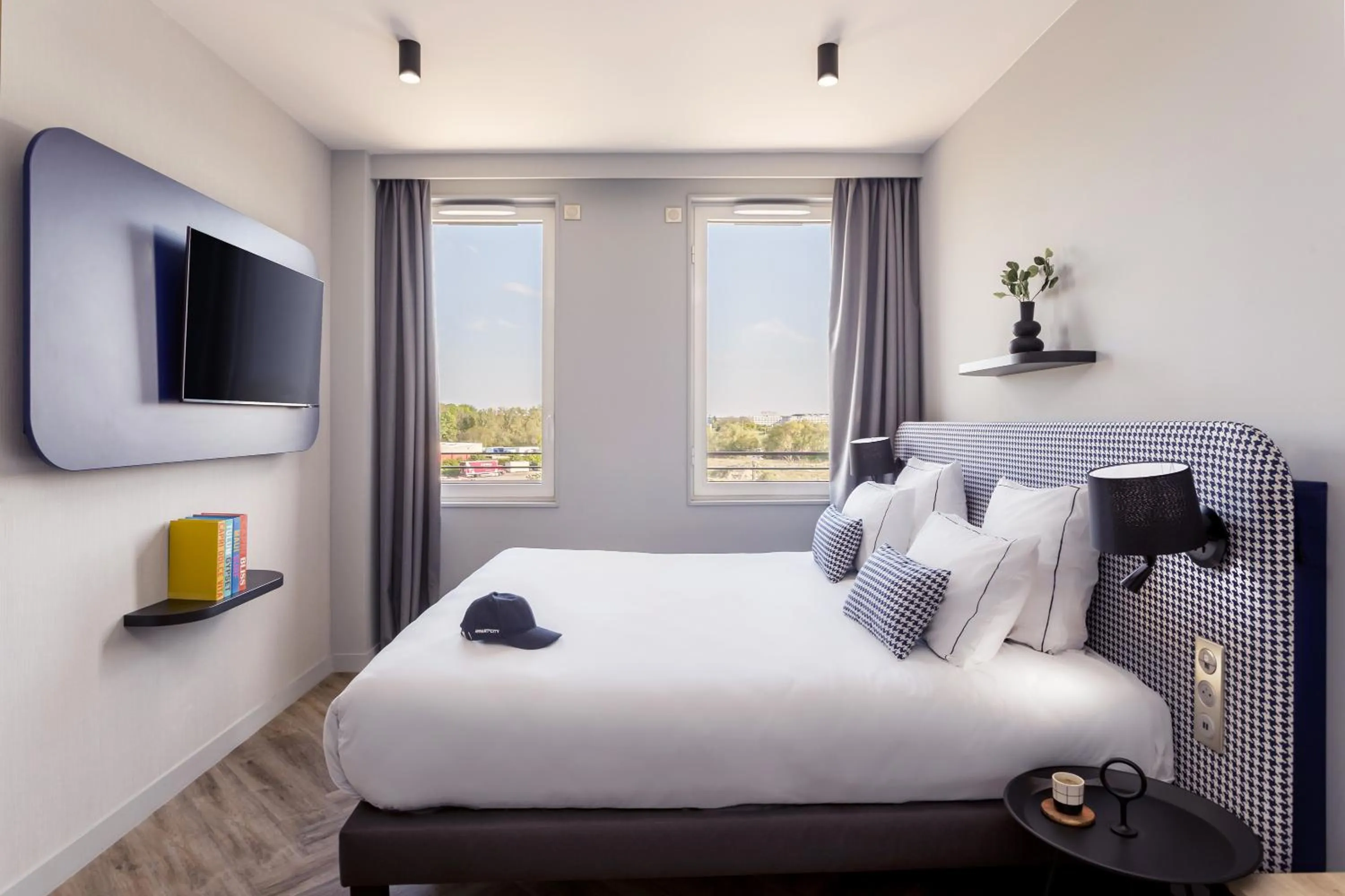 Bed in Appart'City Collection Paris Roissy CDG Airport