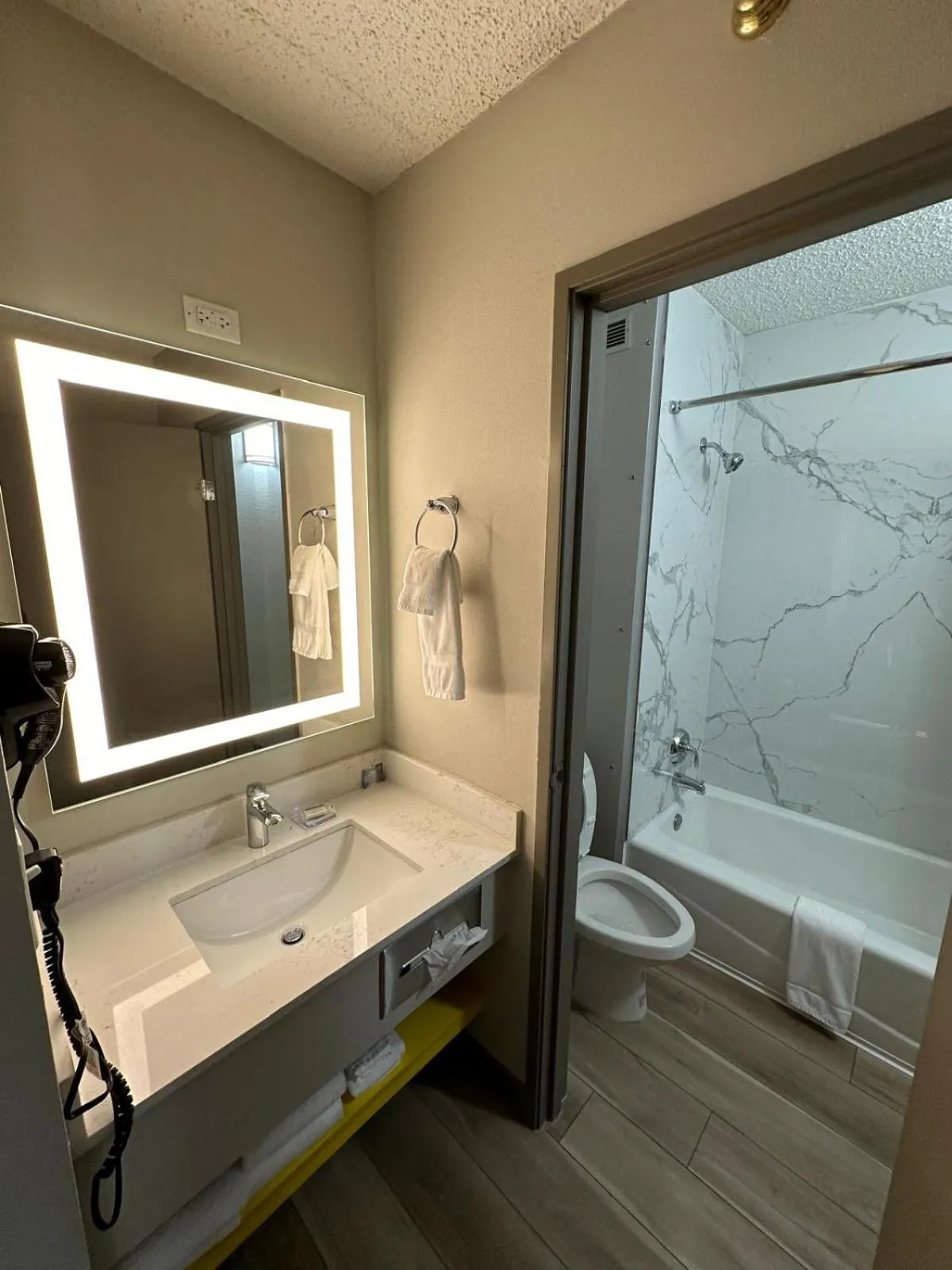 Toilet in Days Inn by Wyndham Mandan Bismarck Area