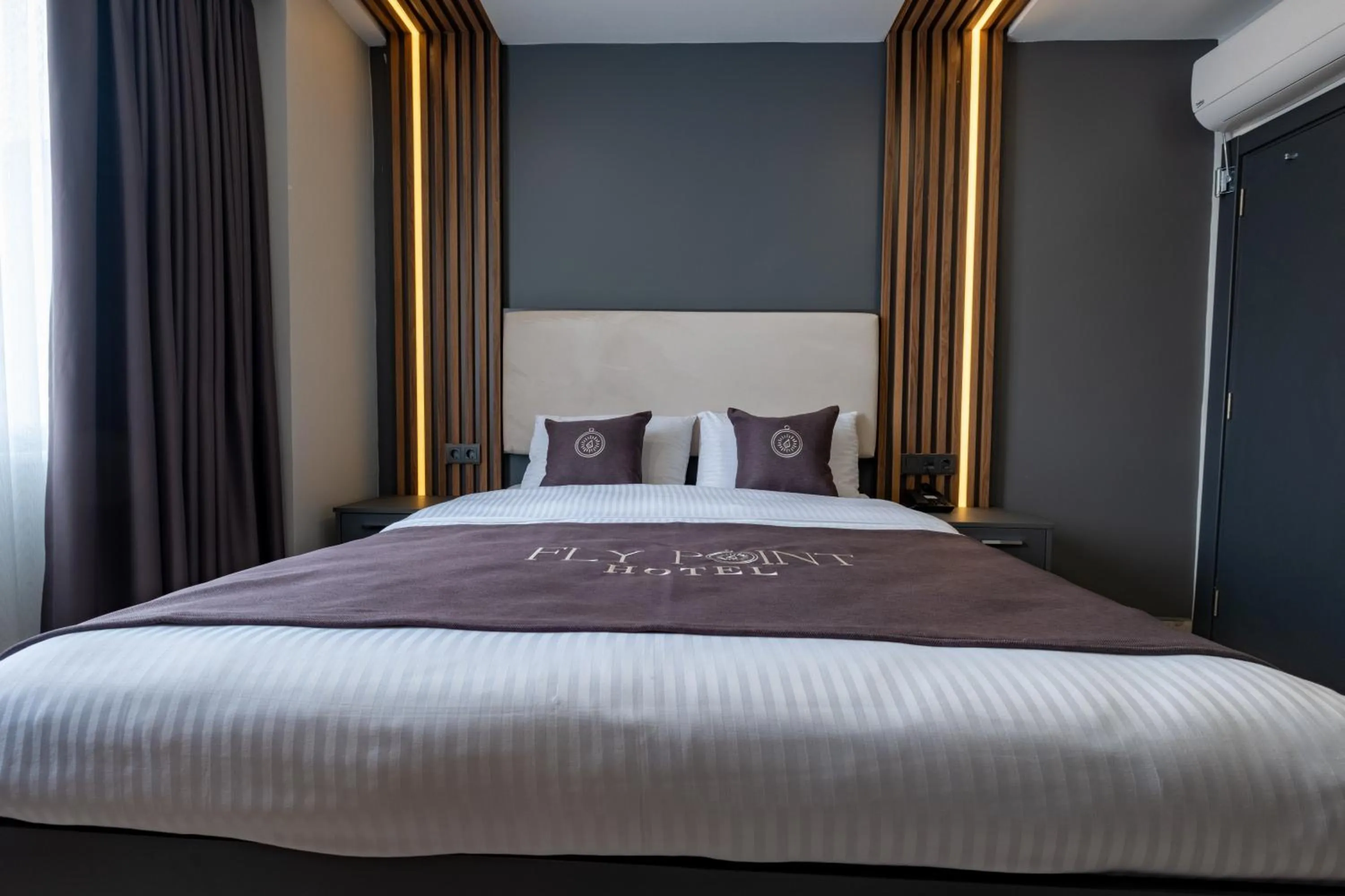 Bed in FLY POINT AIRPORT HOTEL