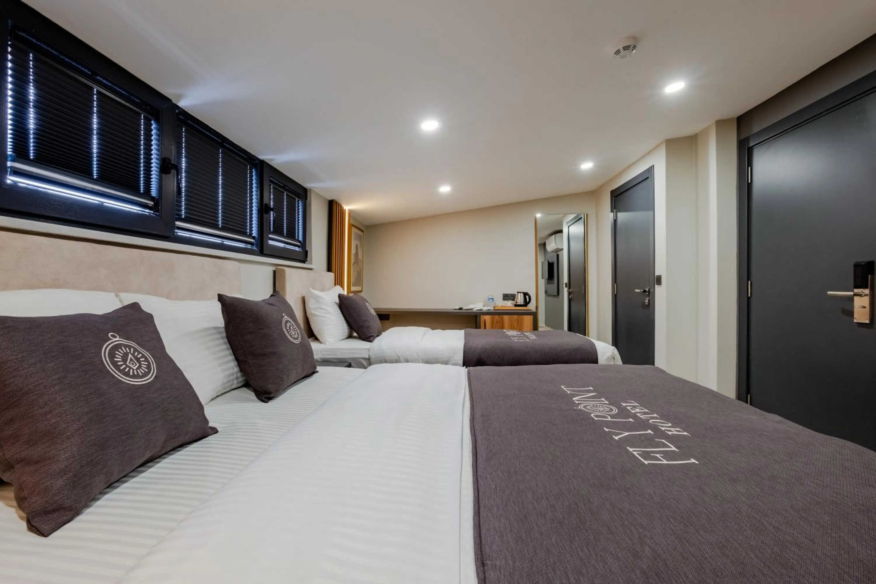 Bed in FLY POINT AIRPORT HOTEL