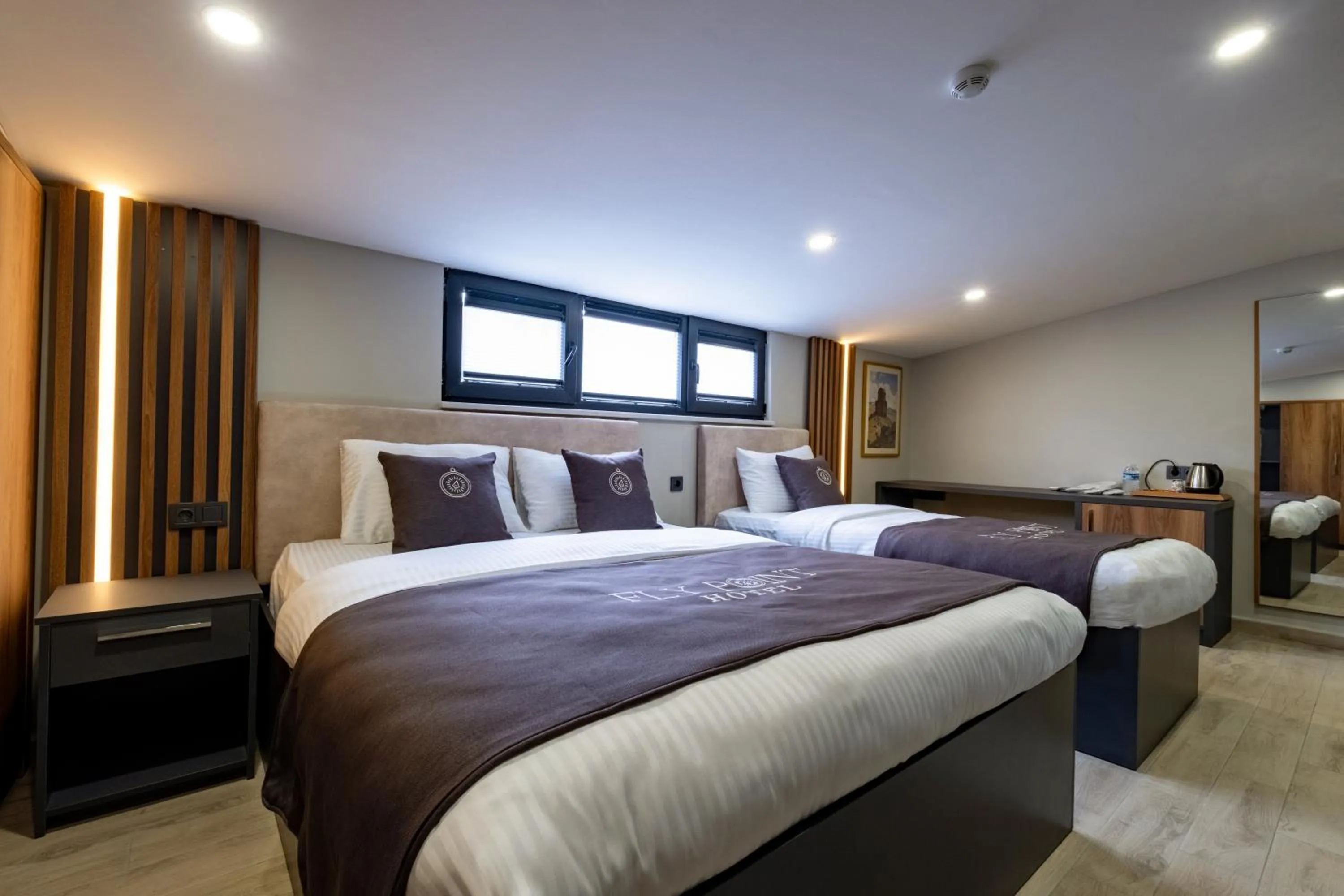 Bed in FLY POINT AIRPORT HOTEL