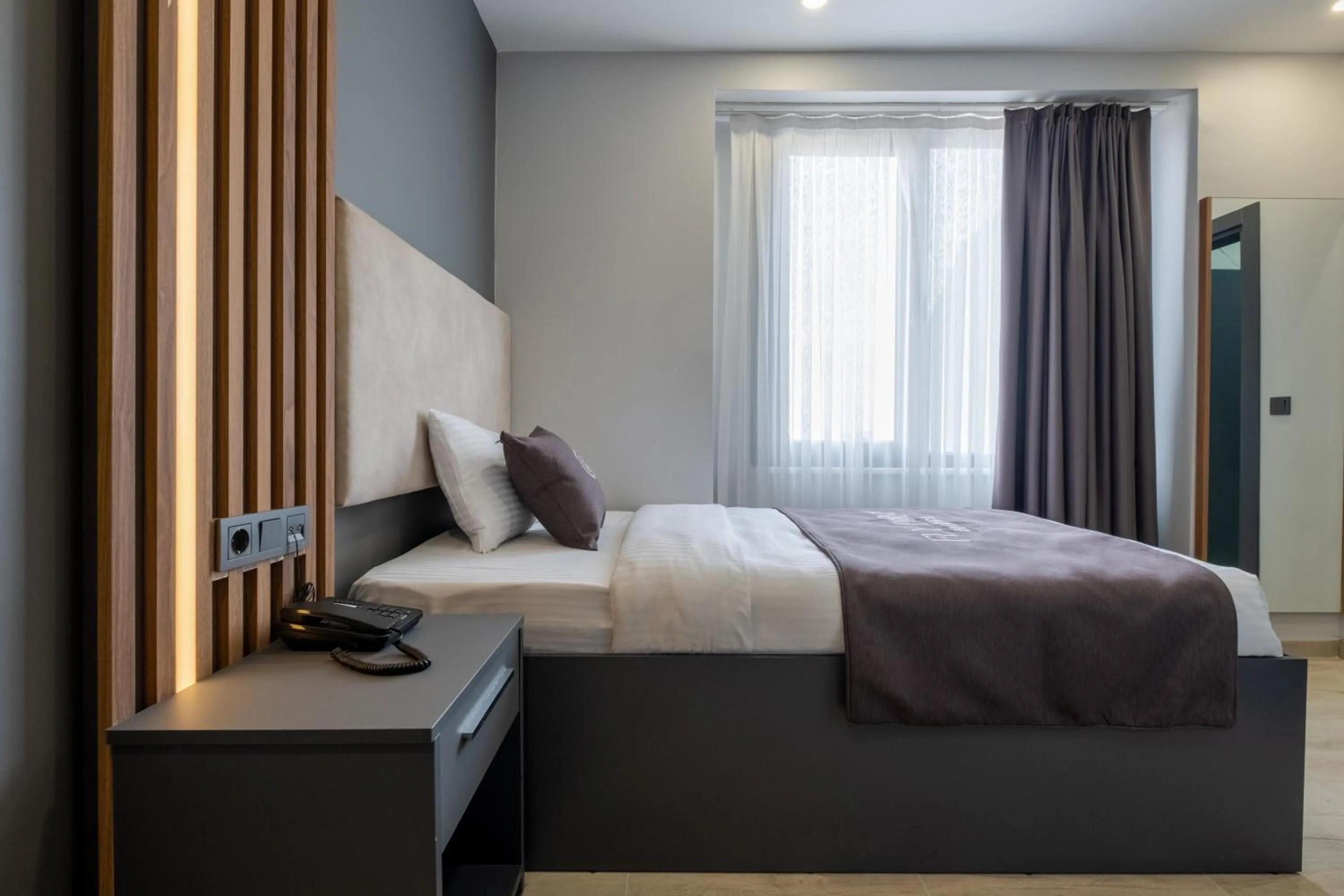 Bed in FLY POINT AIRPORT HOTEL