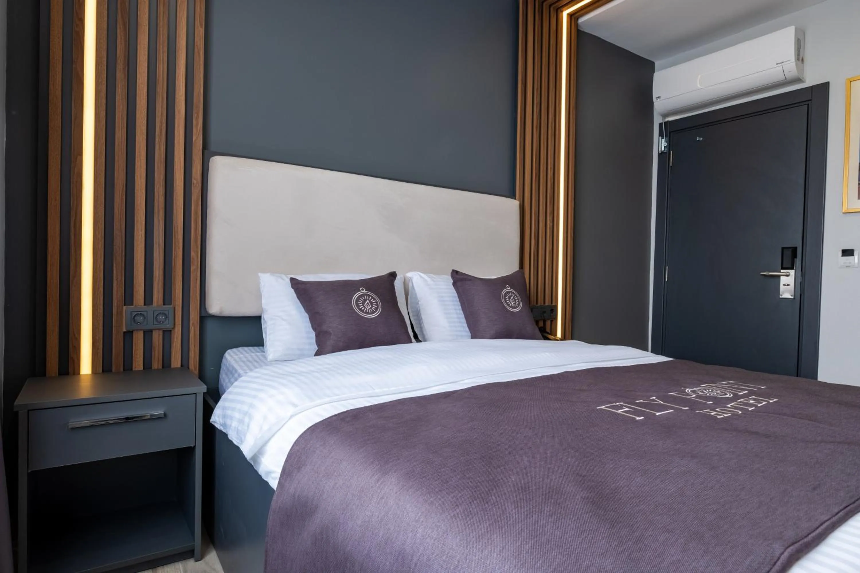 Bed in FLY POINT AIRPORT HOTEL