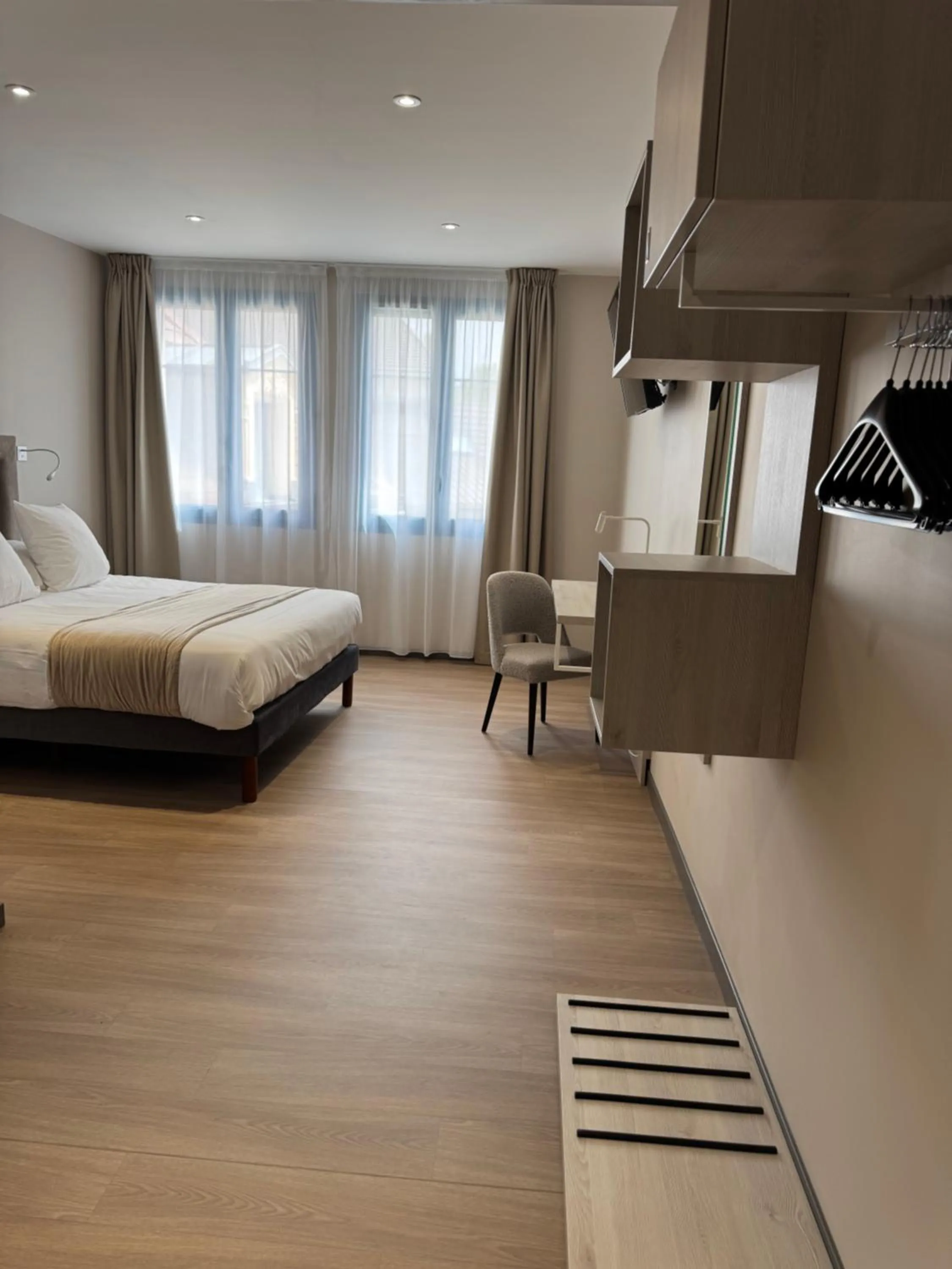 Bed in Hôtel du Commerce-restaurant au Couteau