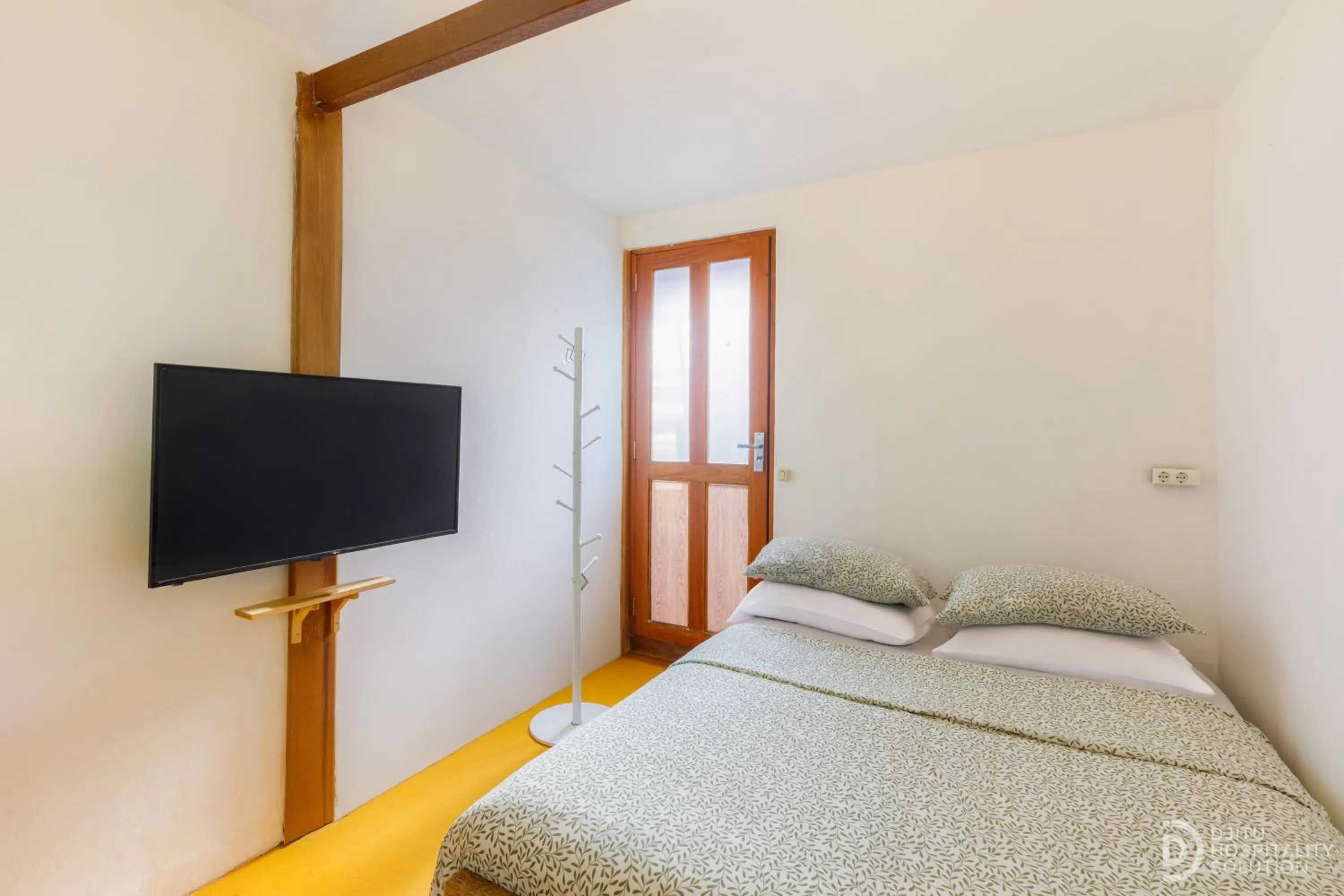 Bed in Yukke Tembi Homestay